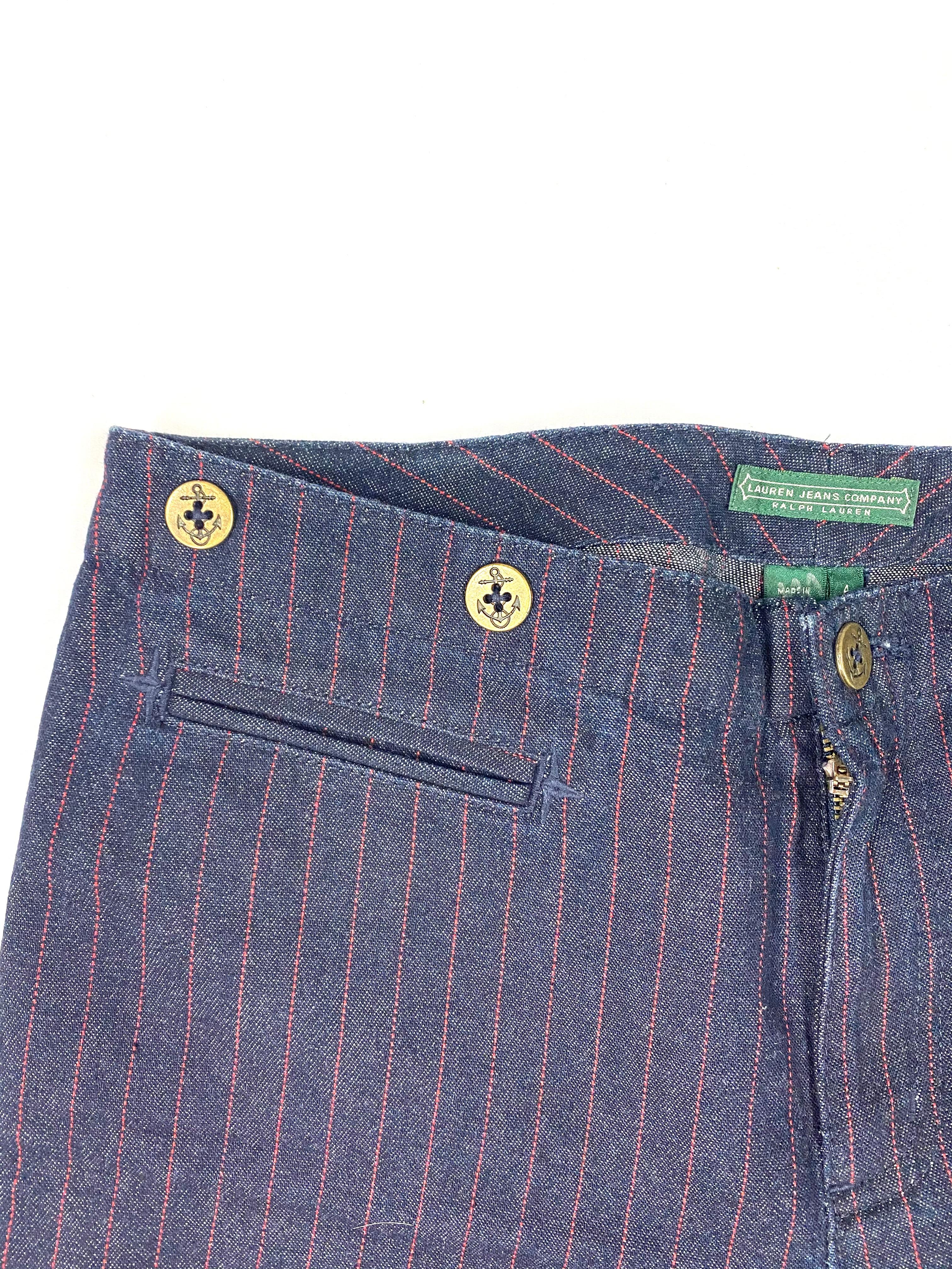 Product details:

The jeans designed by Ralph Lauren, they feature dark blue wash with vertical red striped pattern, straight fit and anchor motif buttons. The leg width is 10.75 inches.