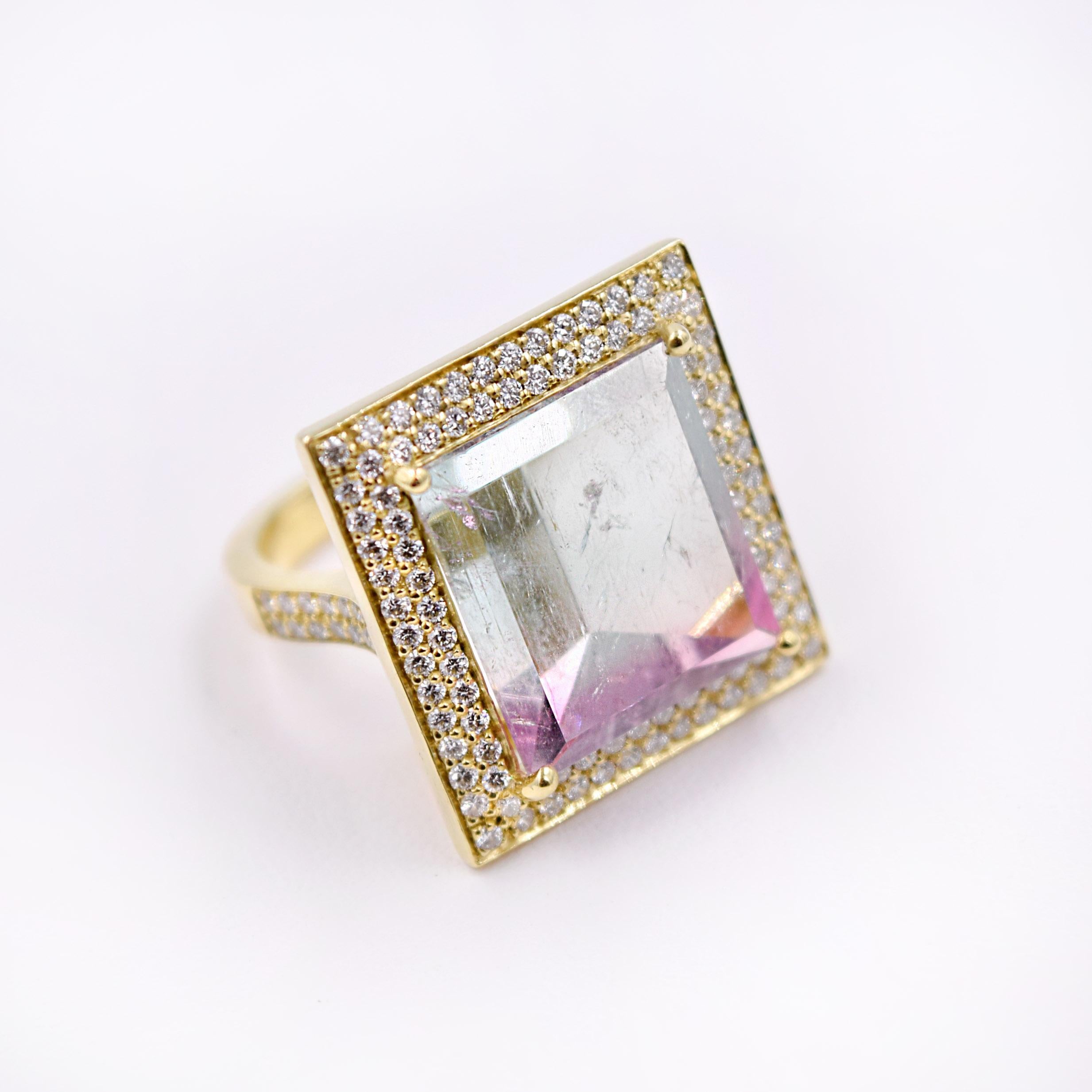 Stunning Mirror Cut 35.71 Carat Watermelon Tourmaline Cocktail Ring.
Two rows of Brilliant White Diamonds, 1.21 Carats,  pave set around the Tourmaline.
Flashy and Fun with its size and geometric design.
The ring is made in 18 Karat Yellow Gold and