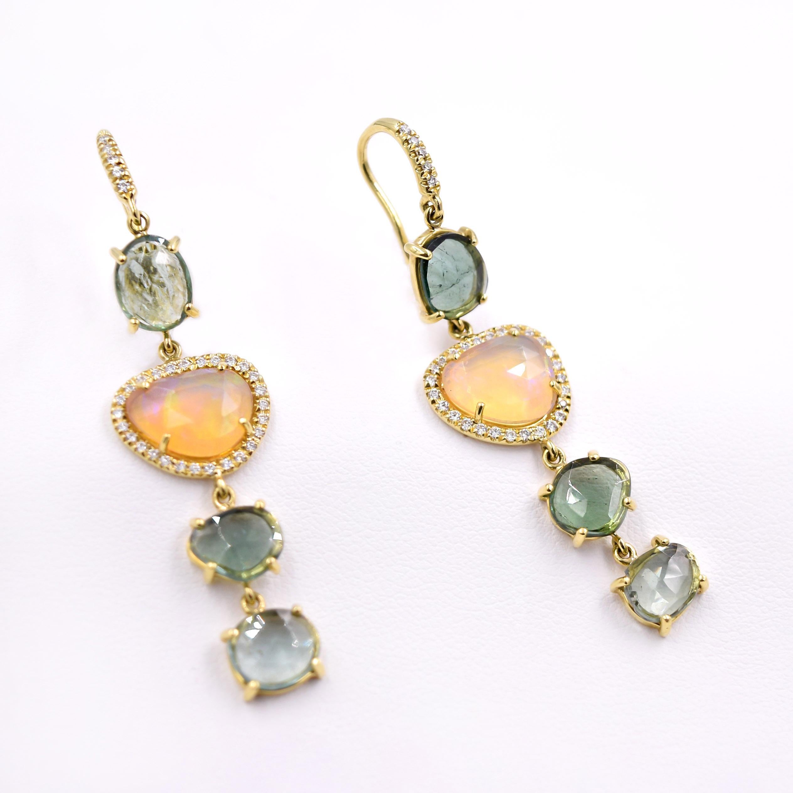 Tourmaline and Opal Dangle Earrings designed by Lauren K.
8.67 carat green tourmaline and rare faceted opal with 0.43 carat white diamonds. 
Stones are set in a prong setting and the metal is 18K Yellow Gold.
Diamonds pave set on the 18 karat yellow