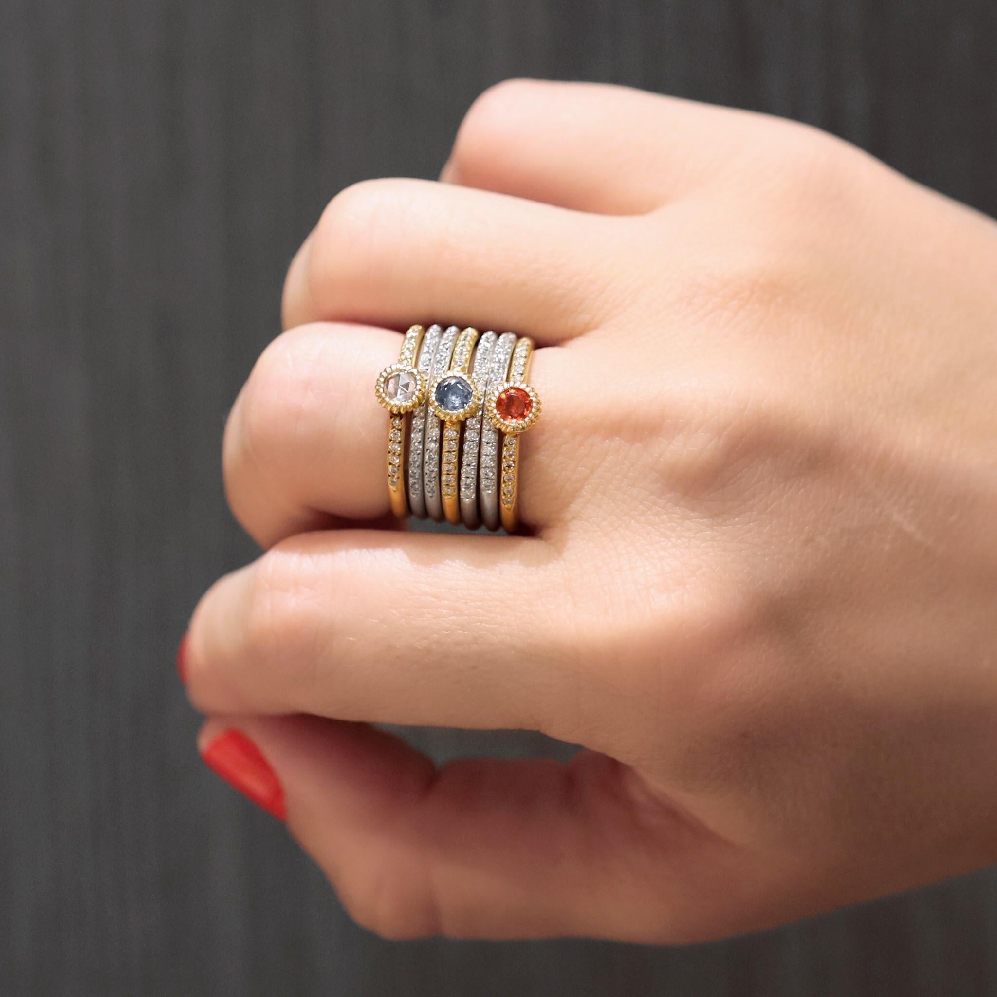 Multicolored Stacking Rings by jewelry designer Lauren K. hand-fabricated in matte-finished 18k yellow gold and matte-finished 18k white gold. The 18k yellow gold bands showcase a 0.20 carat round rose-cut white diamond, a 0.26 carat round orange