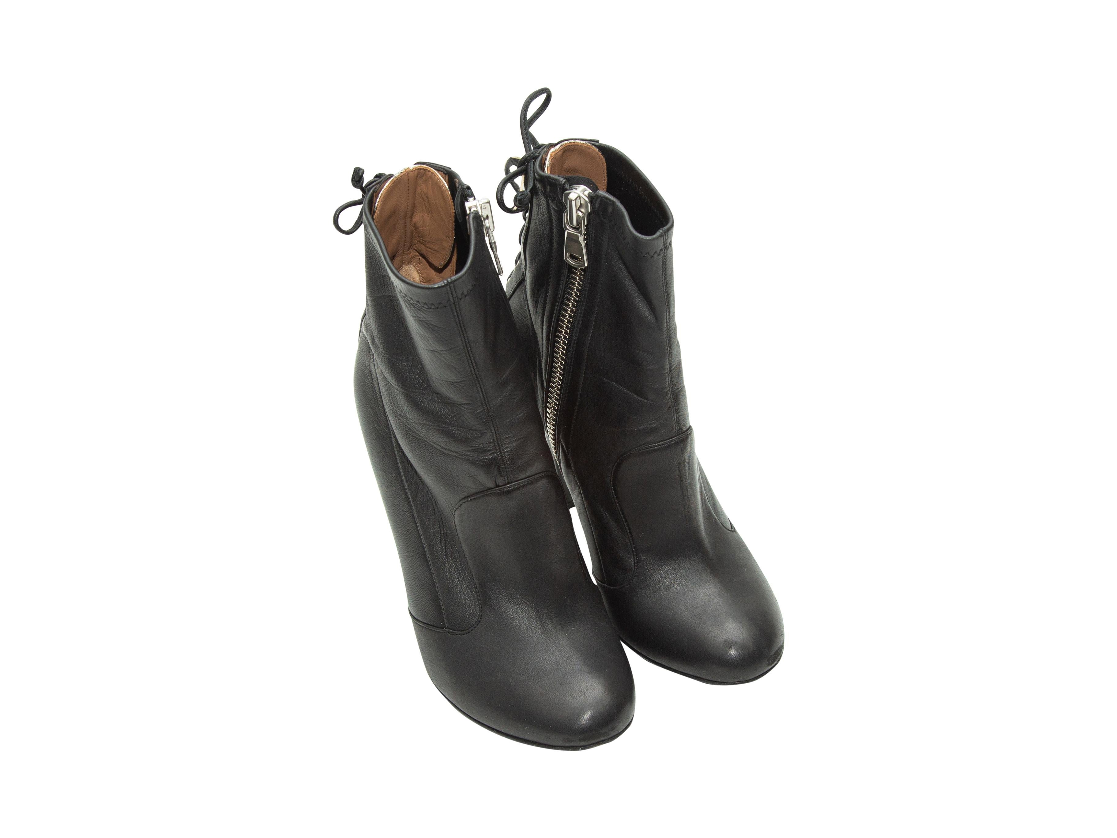 Product details: Black leather round-toe heeled ankle boots by Laurence Dacade. Lace-up detailing at backs. Zip closures at inner sides. Designer size 37.5. 4