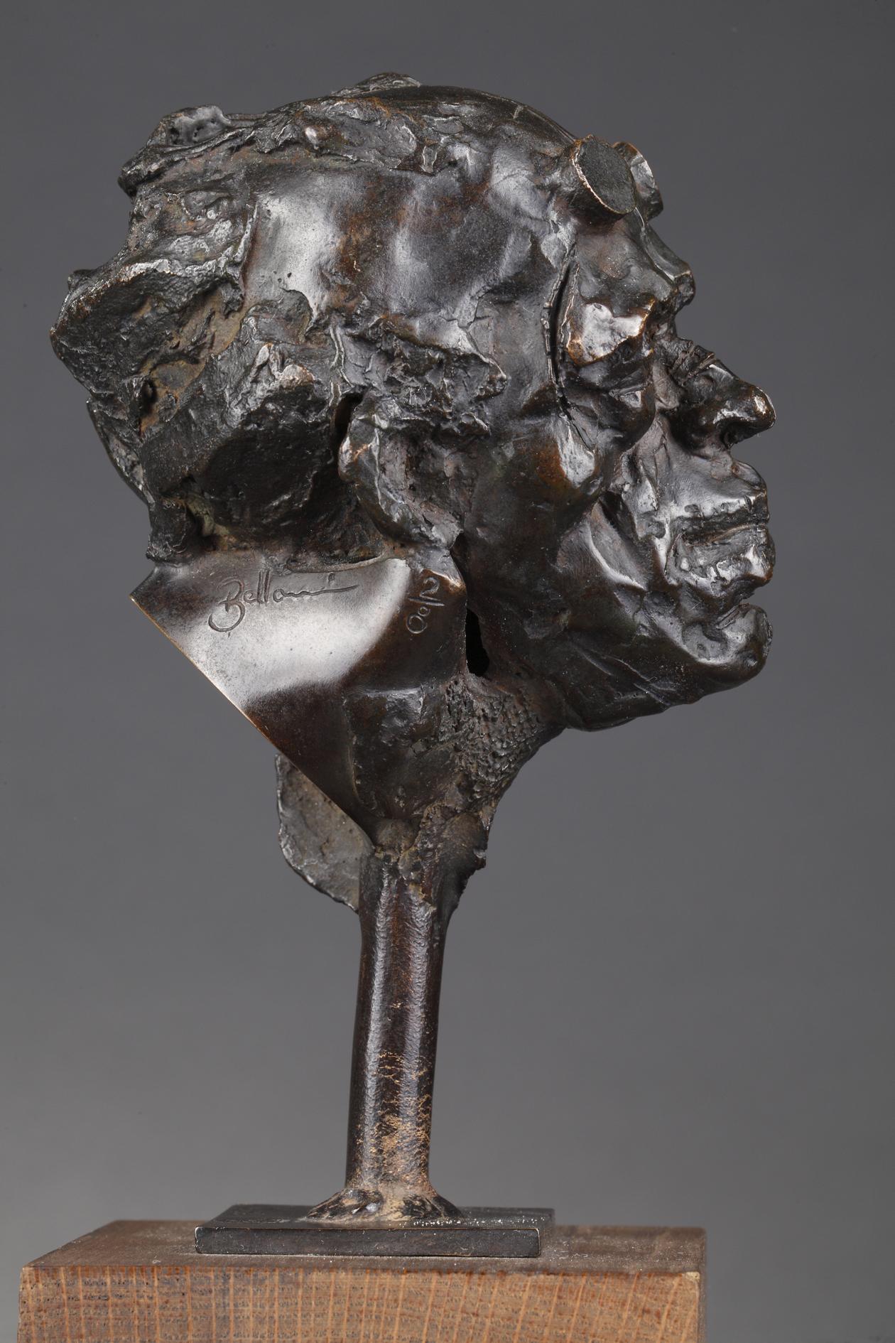 Man's head wearing glasses
by Laurent Belloni (né En 1969)
 
Bronze cast with a nuanced black patina
Signed 
