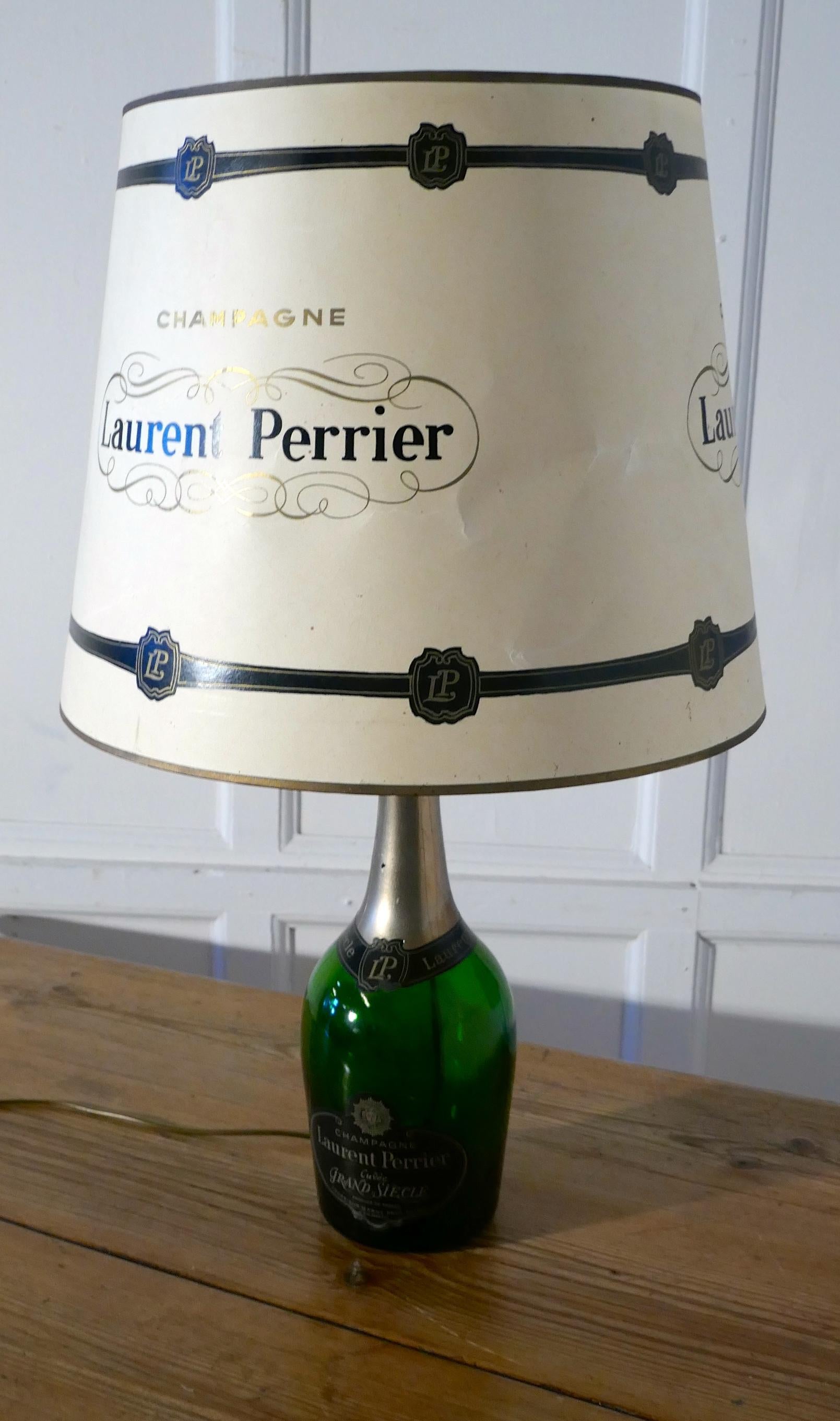 Laurent Perrier Champagne Cuveé Grand Siecle Black Lable advertising table lamp


Fresh from France this superb lamp was part of a Chateau display, it is a genuine 1.5 liter bottle and comes with its original matching parchment shade, decorated