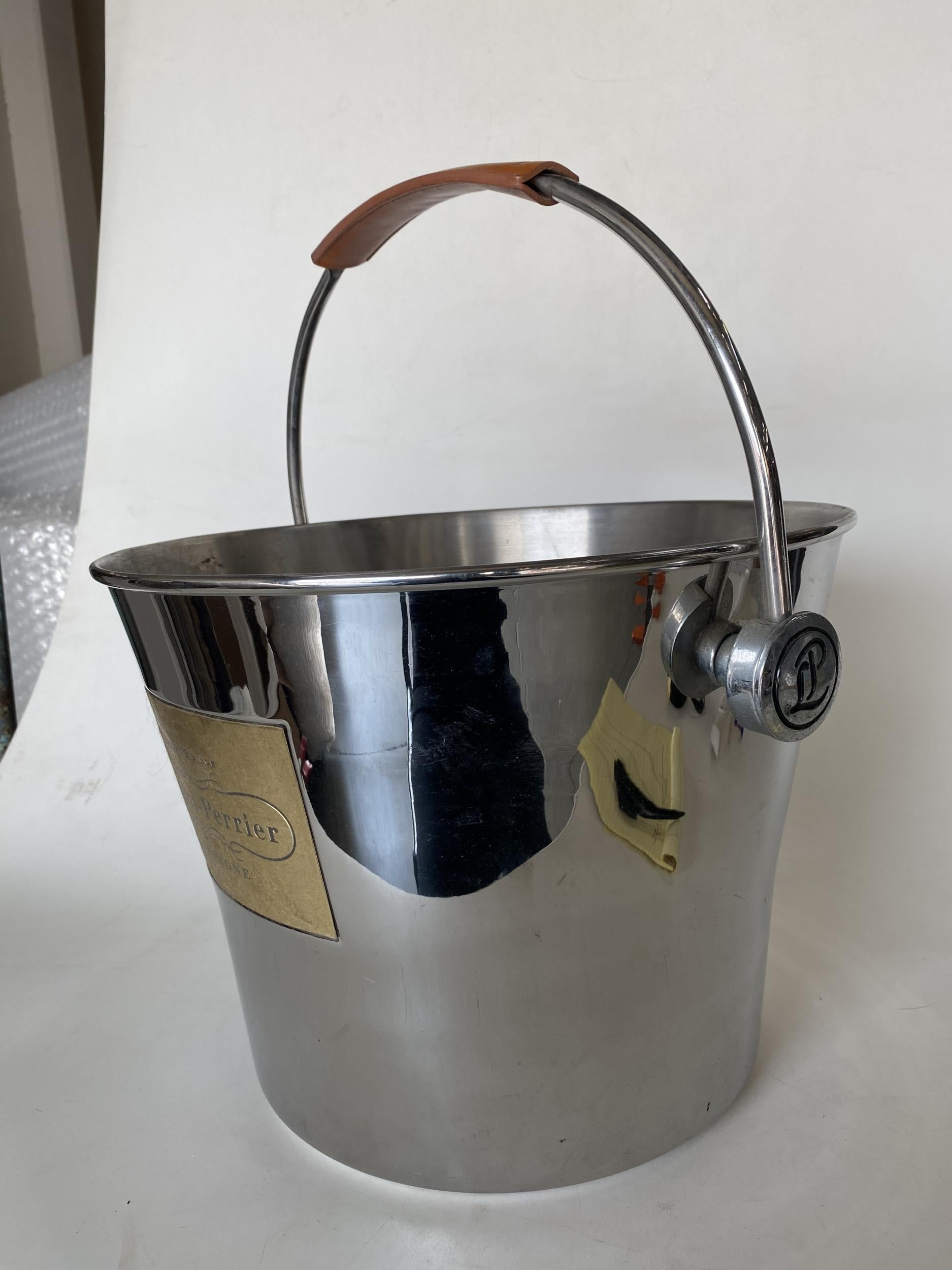 Original Laurent Perrier Champaign silver-tone stainless steel ice bucket with leather handle.
