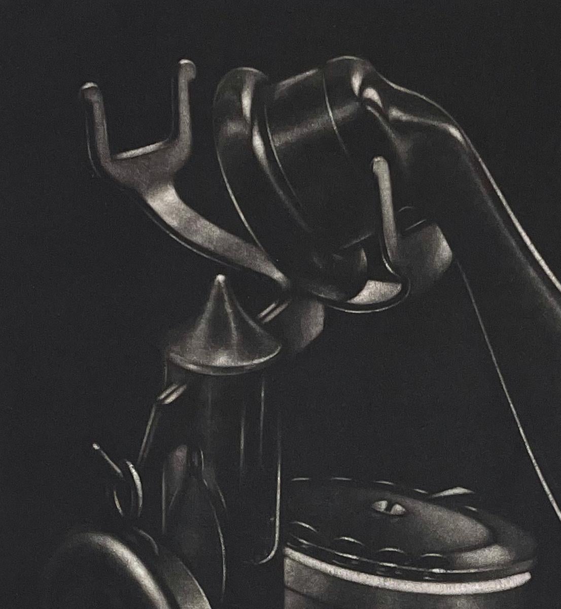 Signed and numbered 11/130. A black and white mezzotint of an antique rotary dial telephone, showing why Schkolnyk is considered a modern master of the mezzotint.   

Born in Paris and trained as a physician, Schkolnyk discovered his talent for