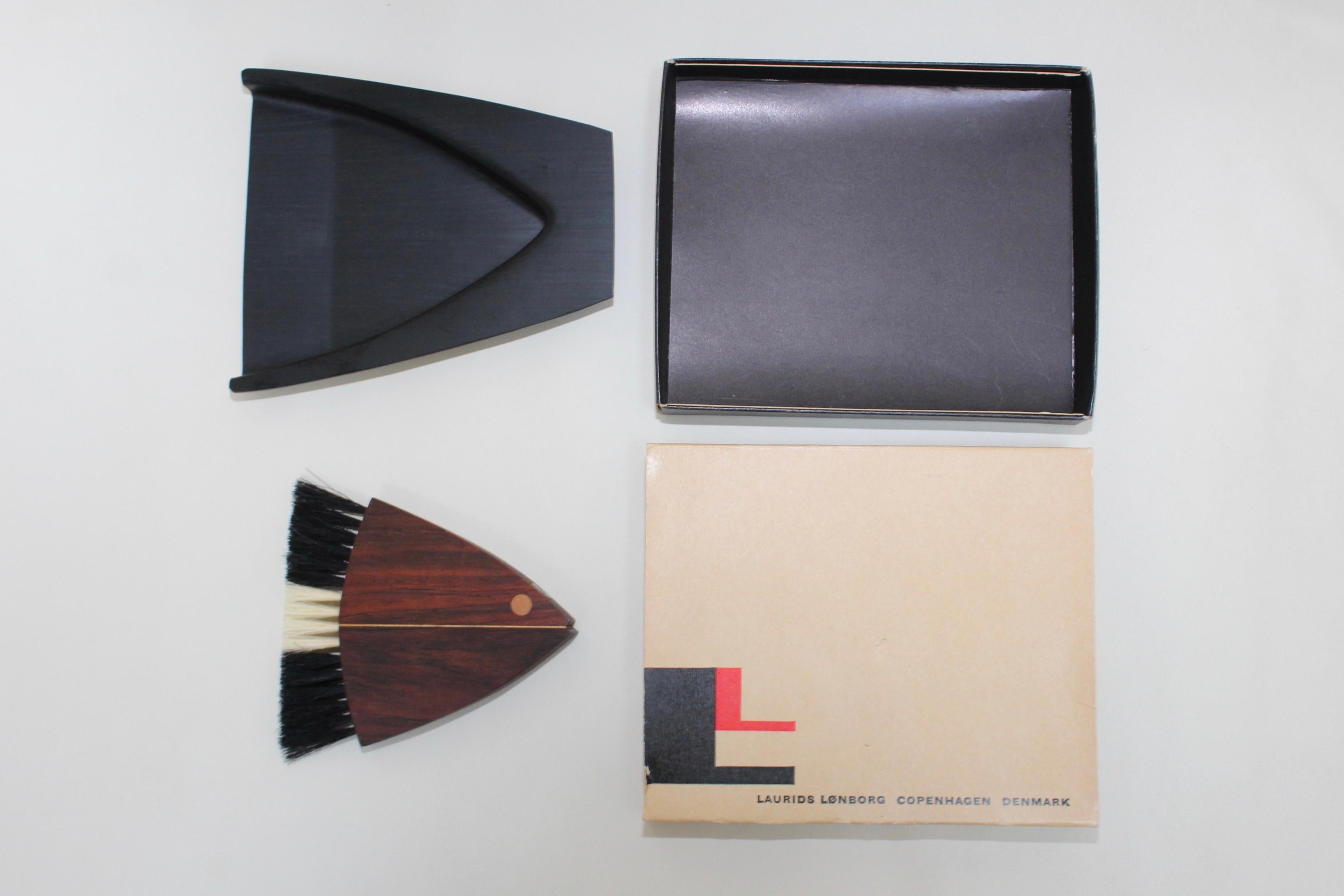 1960s Mid-Century Modern rosewood fish crumb sweeper designed by Laurids Lonborg. In excellent vintage condition with the original box.