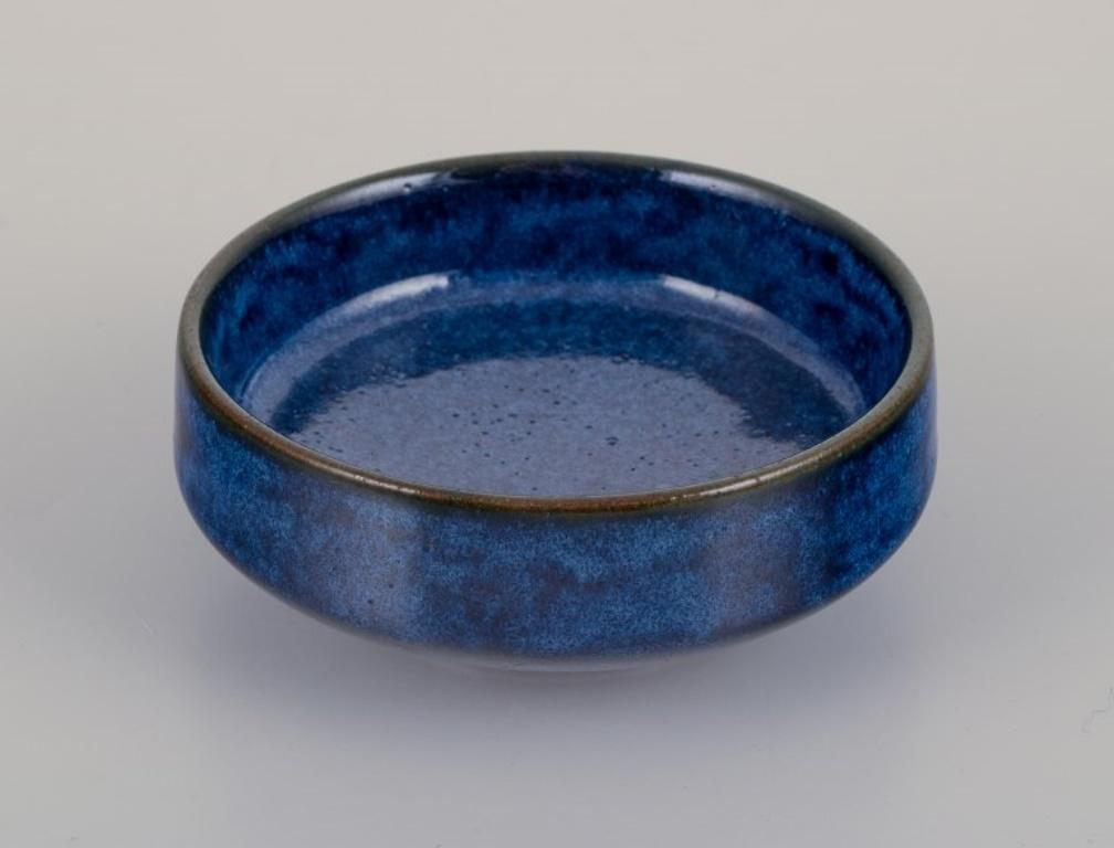 Lauritz Hjorth, Bornholm, Denmark. Small unique ceramic bowl.
Blue-toned glaze.
1960s.
Marked.
In perfect condition.
Dimensions: D 8.5 cm x H 3.5 cm.