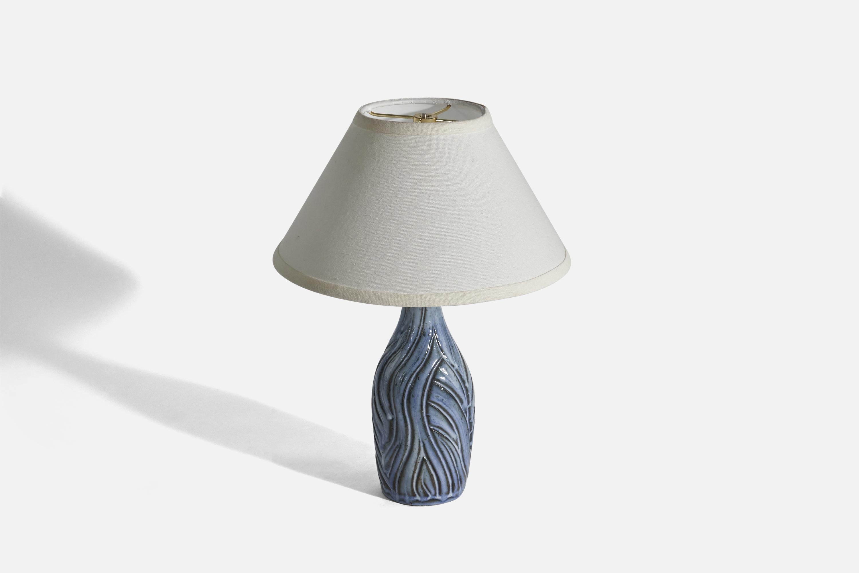 A blue-glazed stoneware table lamp designed and produced by Lauritz Hjorth, Denmark, 1940s. 

Sold without Lampshade(s).
Dimensions of Lamp (inches) : 13.93 x 4.5 x 4.5 (Height x Width x Depth)
Dimensions of Shade (inches) : 5.25 x 12.25 x 7.12 (Top