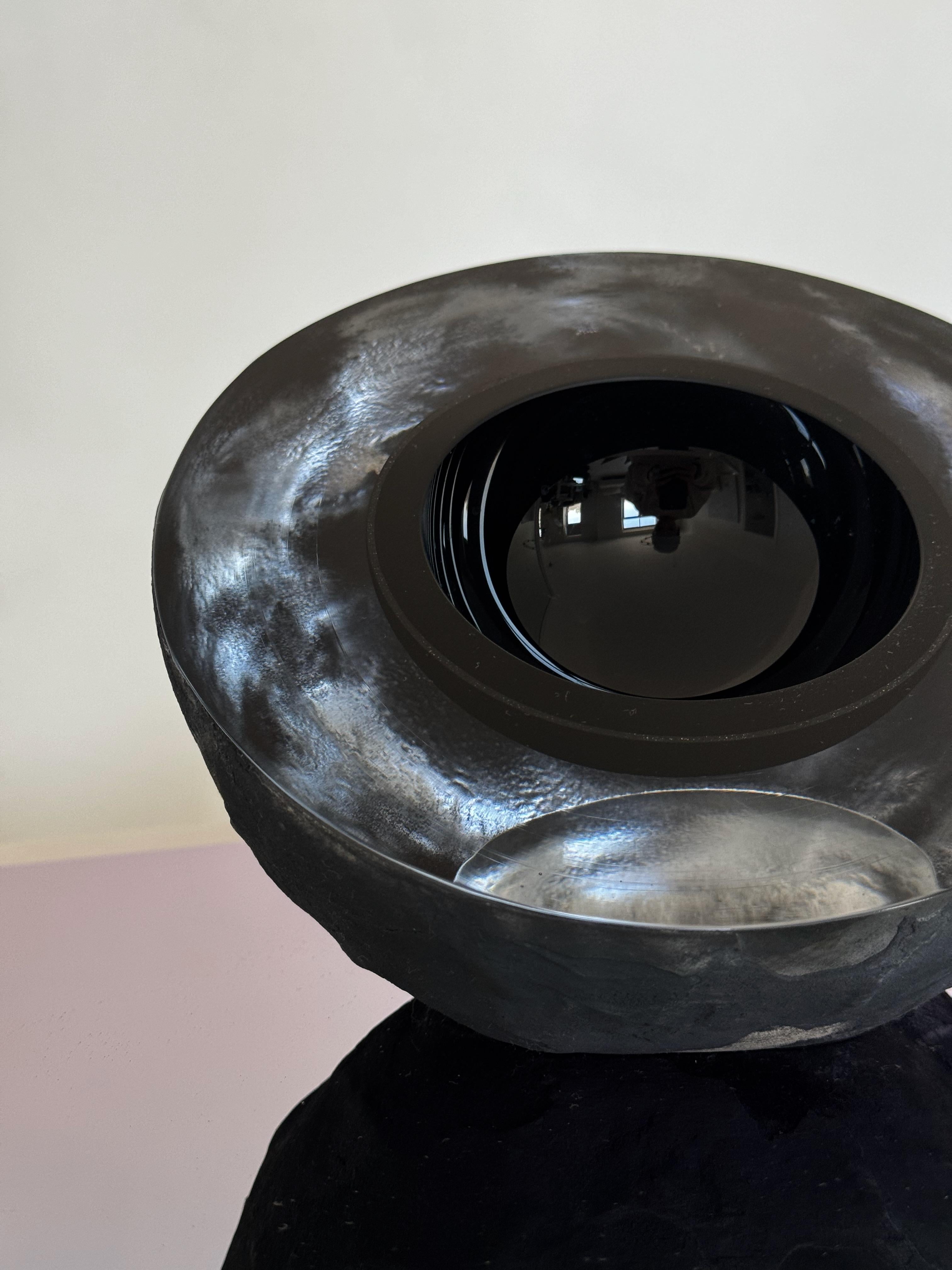 Highest quality, extra-clear glass in ice like effect, coated in black 'lava'.
Author's technique developed together with Baiba Glass.
Unique object with multiple functions - a bowl, a sculpture, an offering dish. 
It has one polished edge that