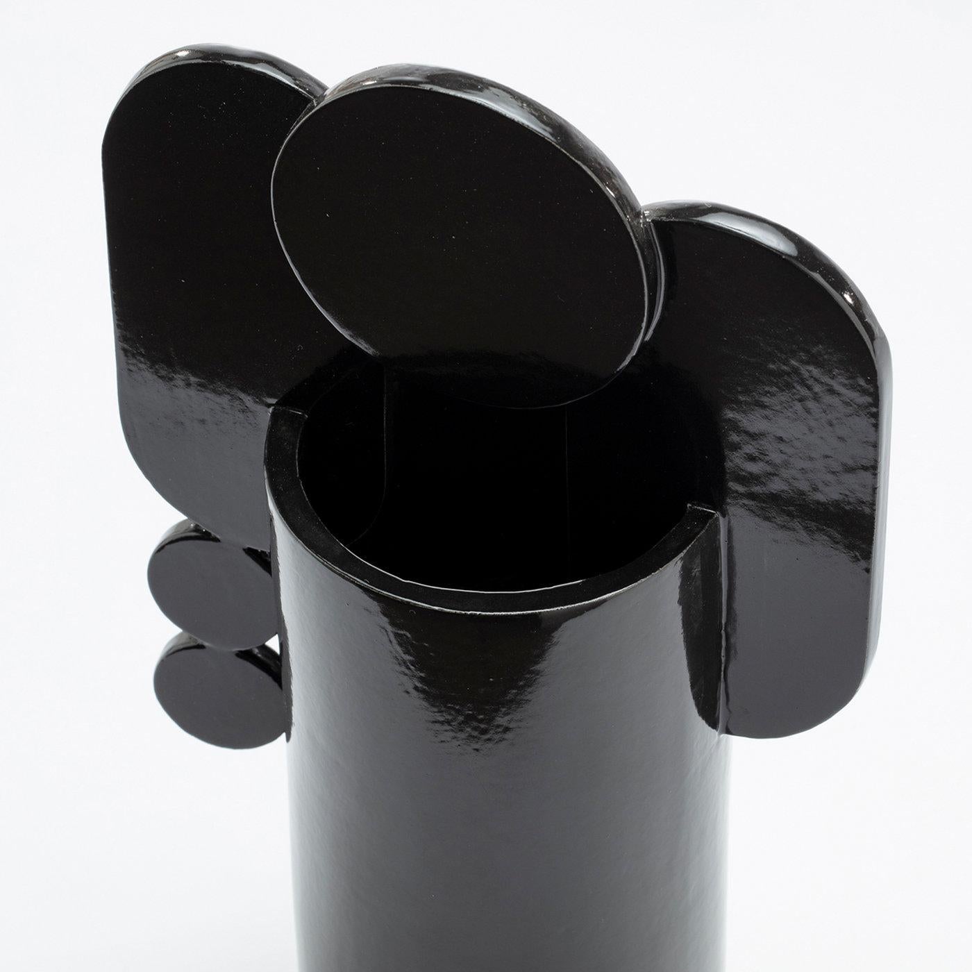 This seductive ceramic vase, with its contrasting black enamel and clear elements, celebrates the powerful aesthetic peculiarities of hardened lava inspired by the Sicilian volcano, Etna. Part of the Bubble Family Collection, the design is marked by