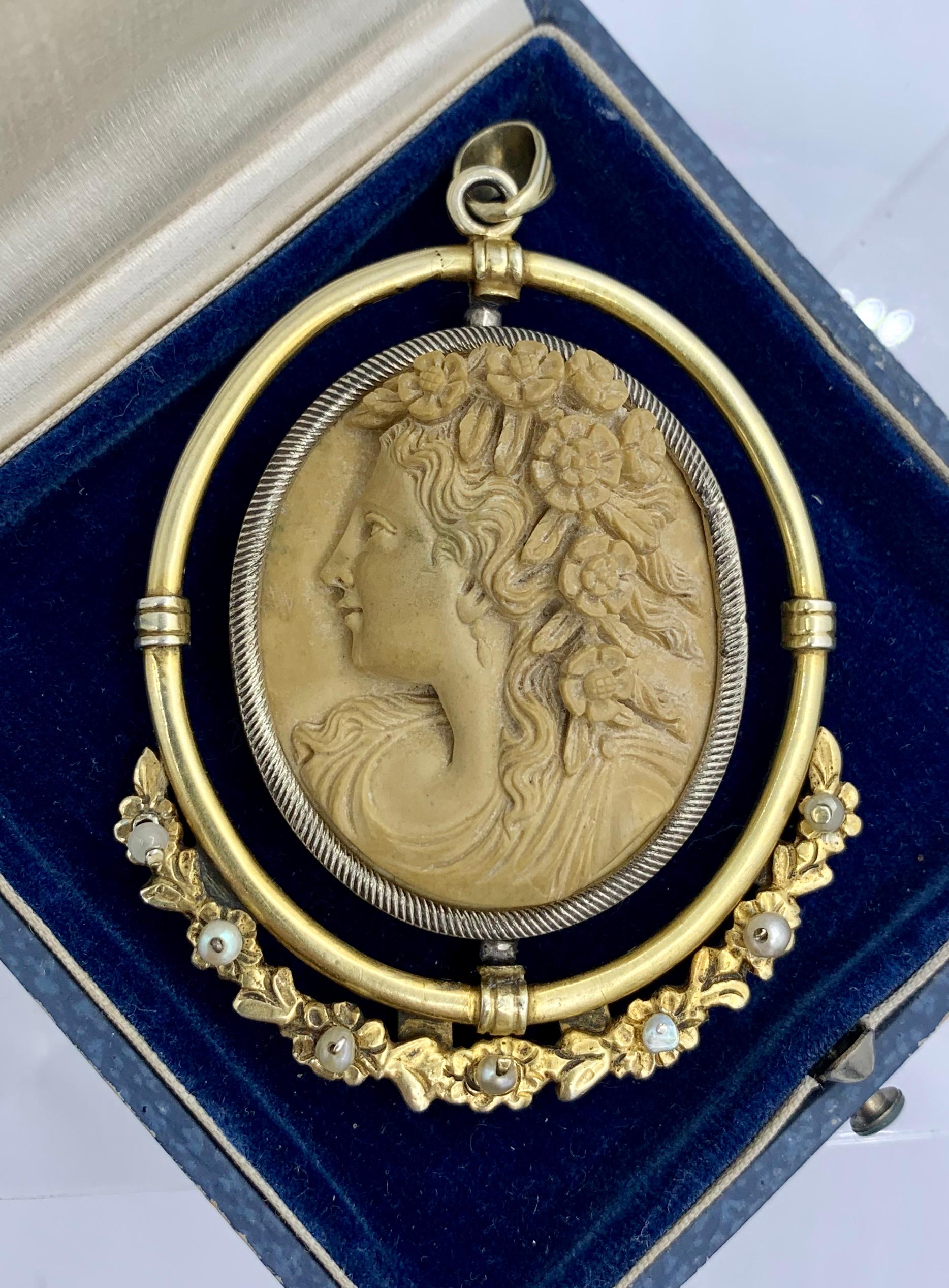 This is a spectacular and very rare monumental antique Art Deco - Victorian - Belle Epoque Lava Cameo Pendant Necklace with a magnificent deeply carved lava cameo of a woman with spectacular flower adornments in her flowing hair.  The cameo sets in