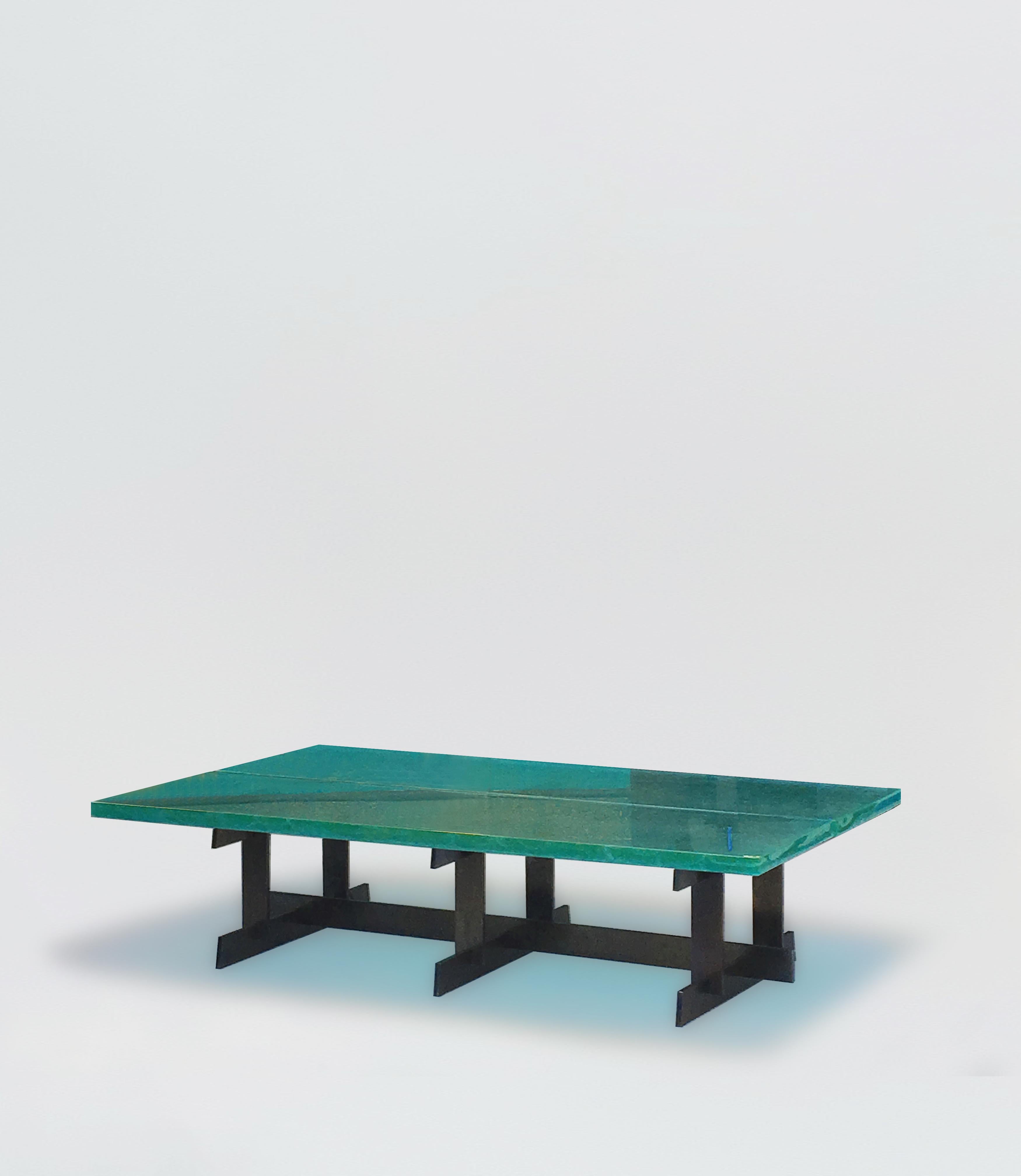 Lava coffee table by SB26
Dimensions: W 160, D 90, H 38 cm
Materials : Thick glass top, hot-rolled mid-iron steel

Lava low table emphasizes the work of the material, in a brutalist expression, with its 35 mm thick glass top, and its