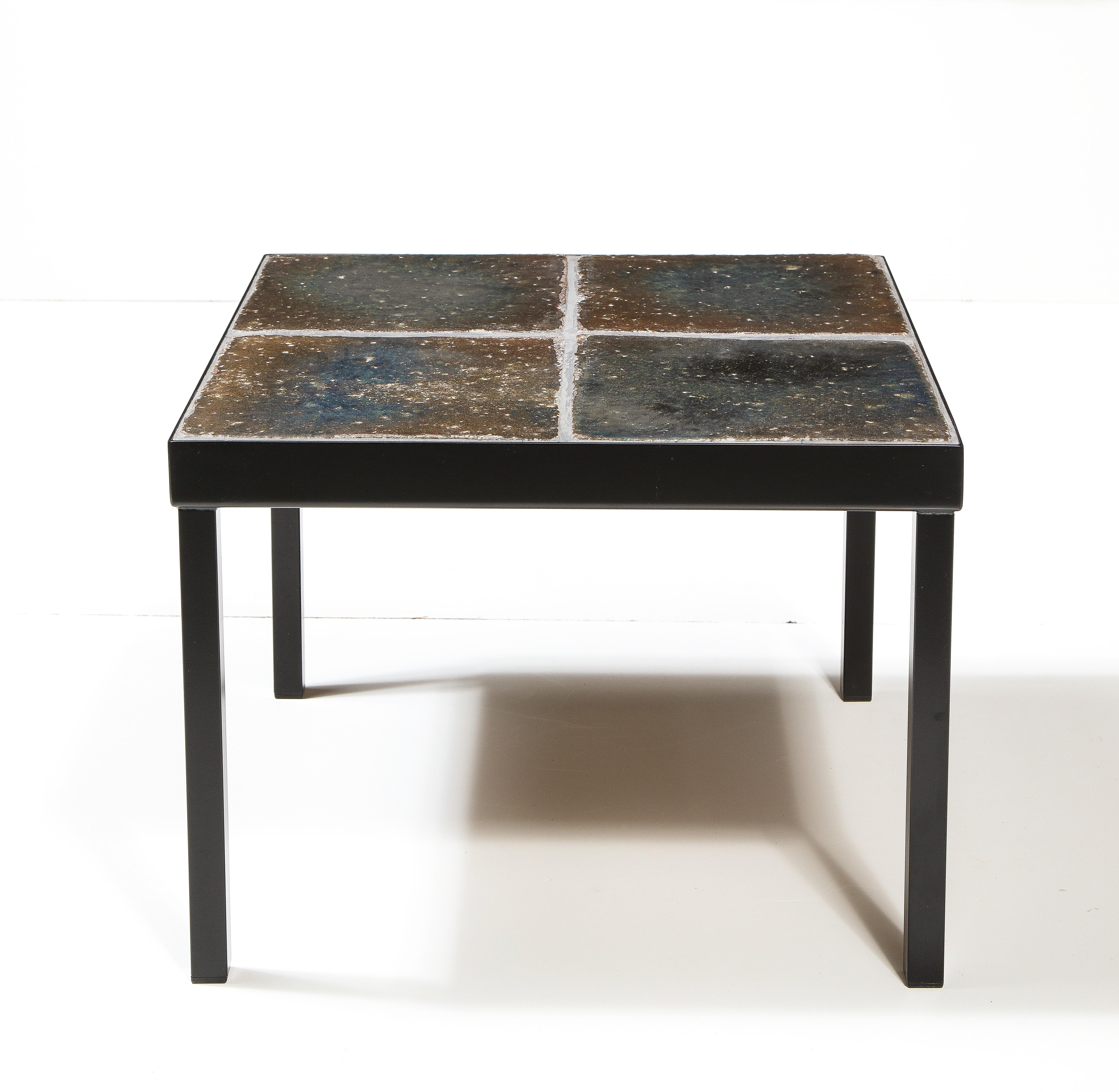 Lava Enameled Side Table, Italy, c. 1960s 

This attractive side table consists of sleek rectangular metal legs and a square enameled lava tile top.