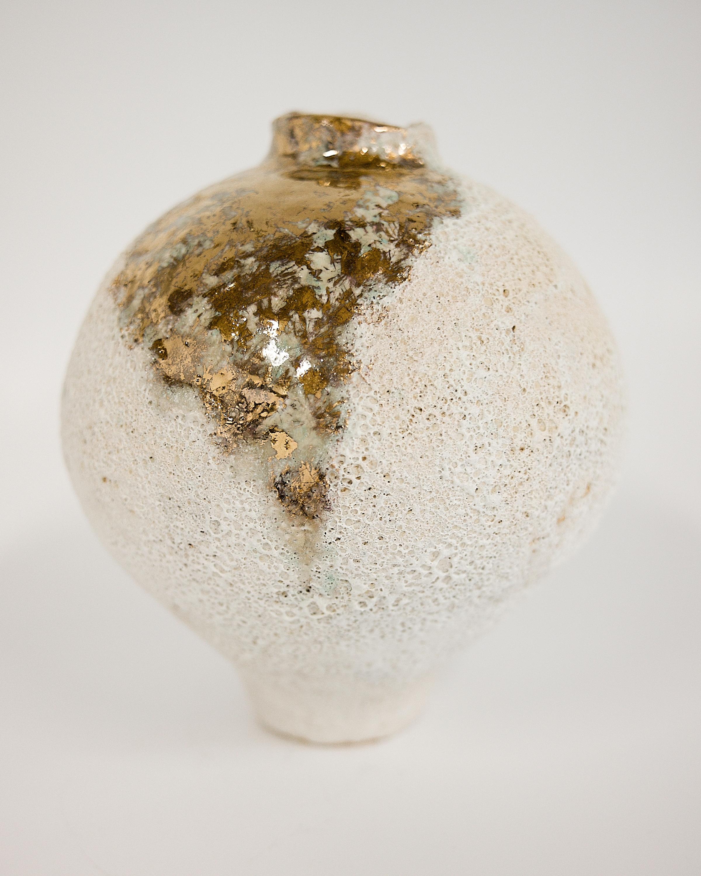 very special Vase

covered in cream Lava glaze and A lot of Gold Lustre 

Balloon shape delicate vase .

One of a kind 

10