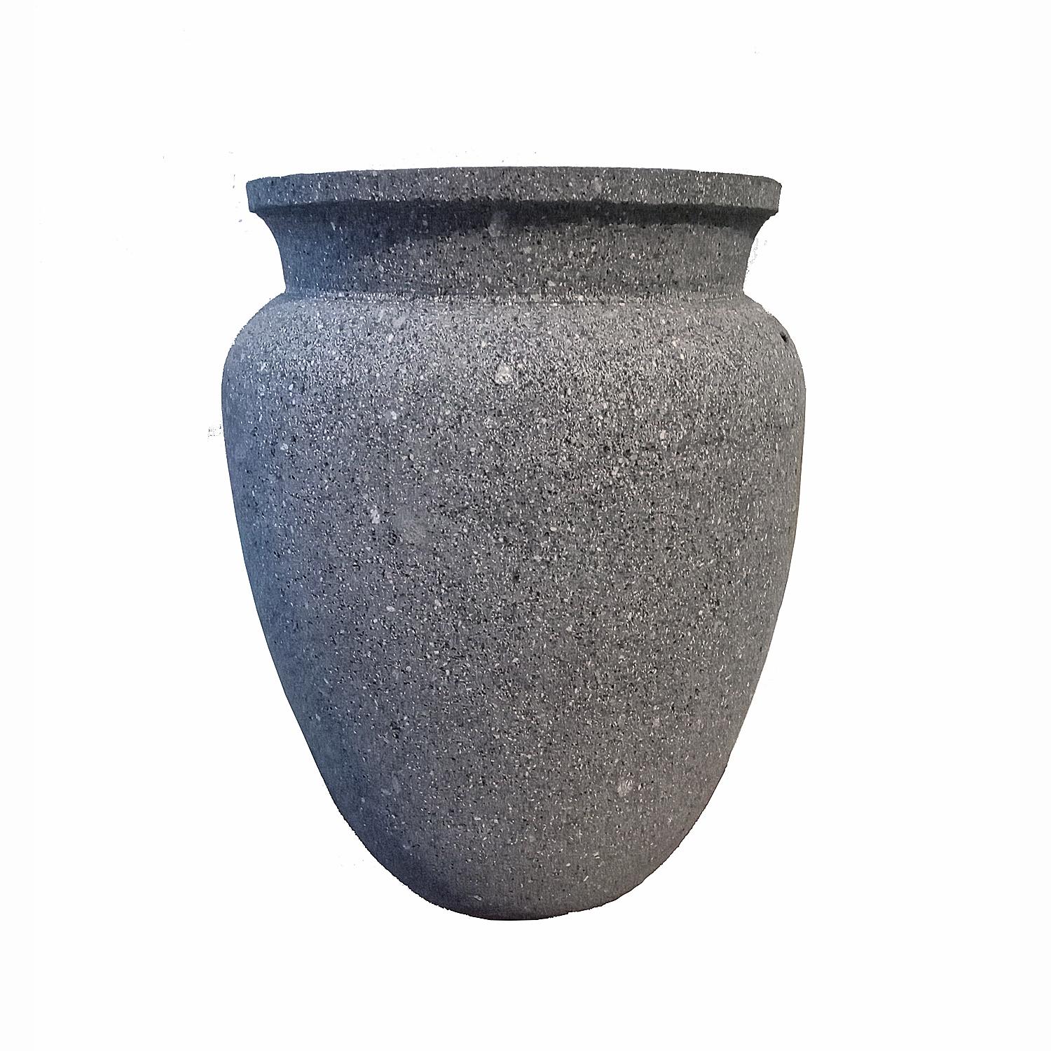 A dark lava stone bowl in a round, shallow shape, hand-crafted in Mexico. An organic modern accent to home décor, in the kitchen, living room or any other area, indoors or outdoors. Its softly rounded edges bring out the texture of stone to take