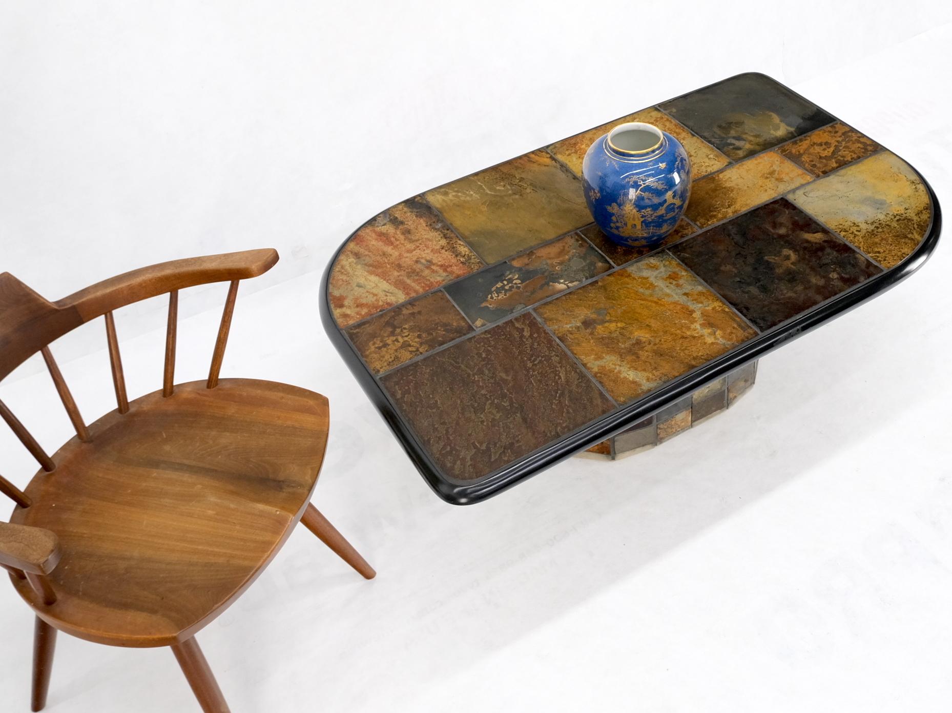 Lava rock multicolor tile top pedestal base guitar pick shape coffee table.
Custom multicolor studio made ceramic pottery tiles coffee table.