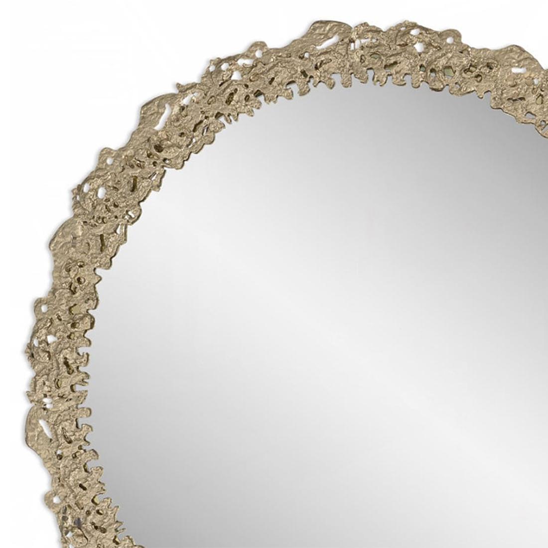 Mirror Lava round with casted solid
brass frame in matte finish and with clear 
glass mirror.