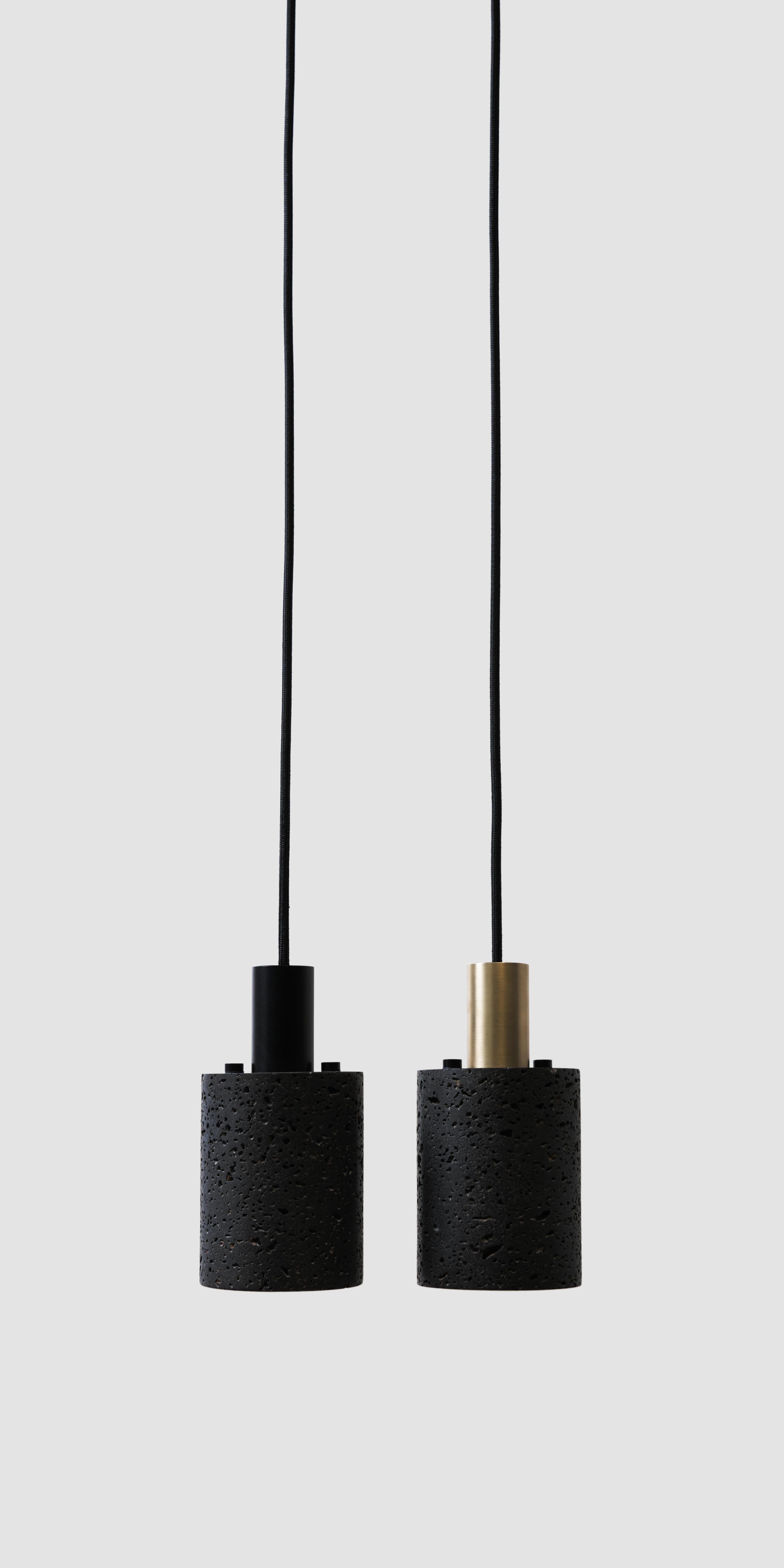 Material: Lava stone
Fittings: Brass
Color: Black
Dimension: 100 x 100 x 195 mm
Weight: 1.84 kg
Cord: 2950 mm
Light Source: LED E27
CCT: 3000-3500 K
CRI: 80-90 Ra
Flux: 230 lm
Supply: 86240 V
Wattage: 3 W, max 40 W

About the artist/