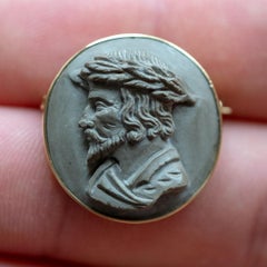 Lava stone cameo brooch set in 18ct gold