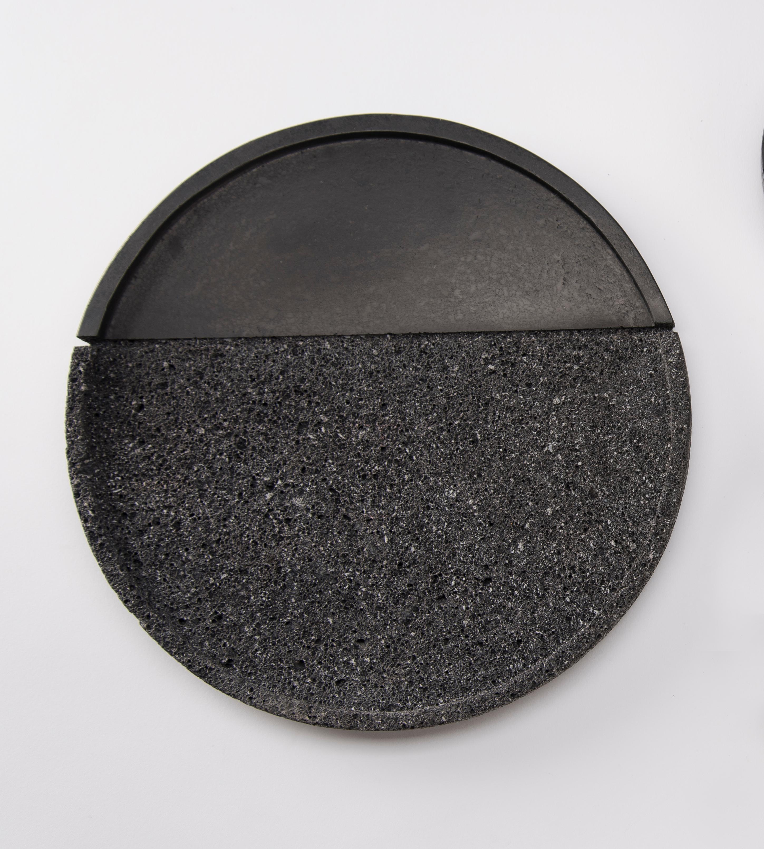 Volcanic stone is a witness to the power of nature: hand-polished by craftsmen with a millenary tradition, its unruly nature is transformed into a sensible and human object. With their dual texture, the collection of Lava plates is as much an homage