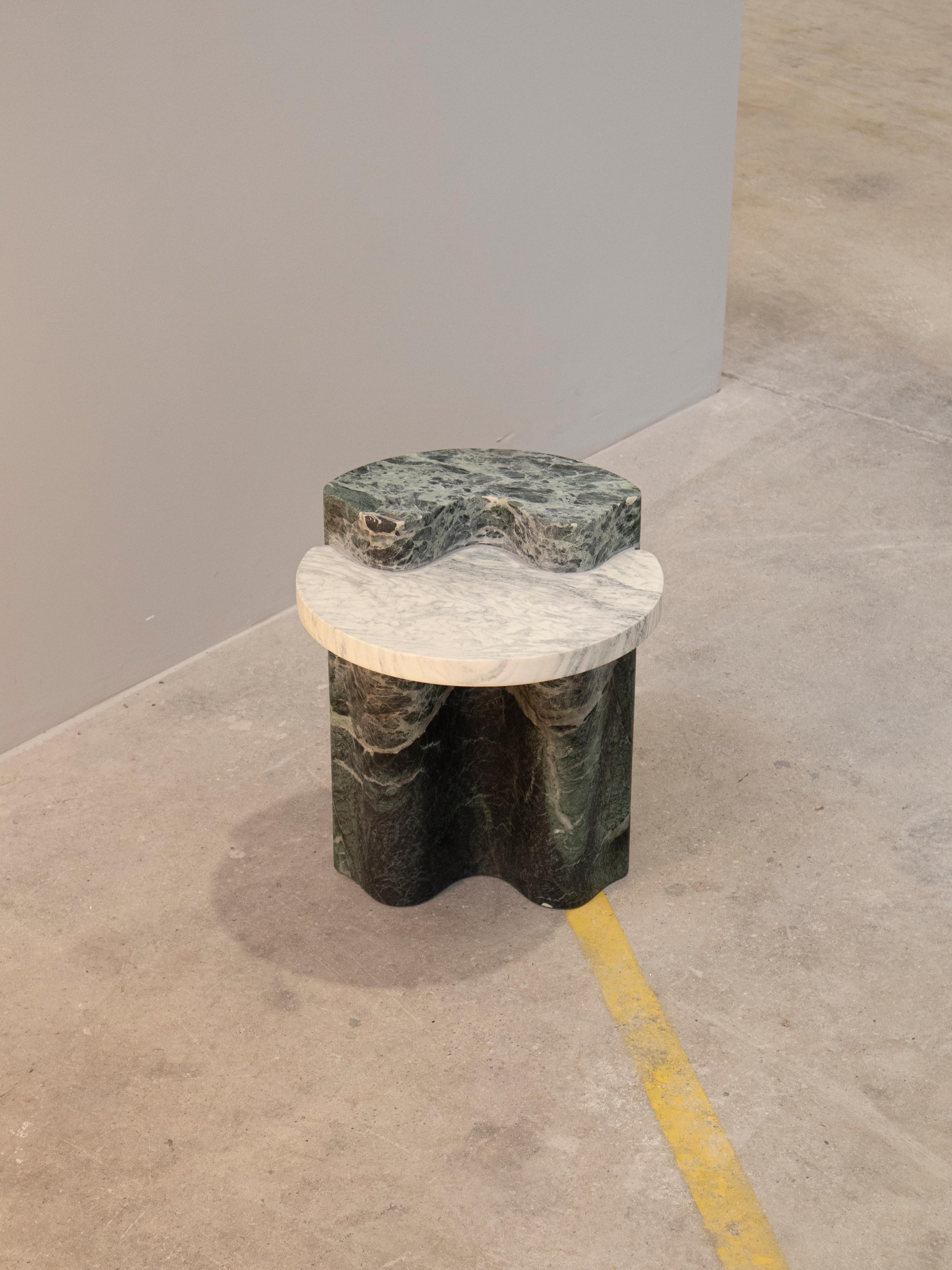 The Lavanche side table is the perfect addition to the Lavanche furniture series. Inspired by the snow-capped mountains and the unique shapes they create, this side table is crafted from Verde Alpi marble, displaying majestic green hues reminiscent