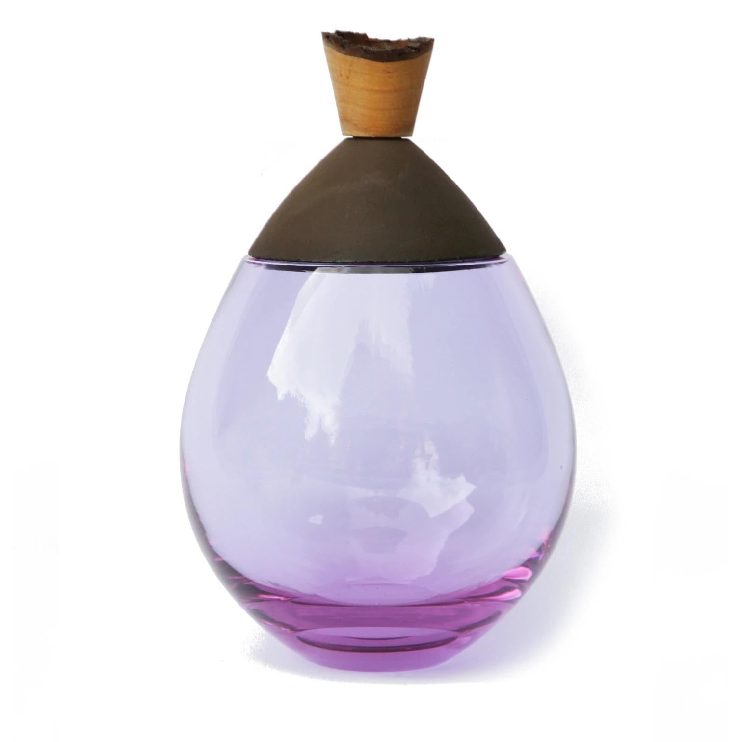 Lavender and black Satu stacking vessel, Pia Wüstenberg
Dimensions: D 19 x H 23
Materials: glass, wood, ceramic
Available in other colors.

Handmade in Europe: handblown glass (Czech Republic), earthenware ceramic (Germany), hand turned wood