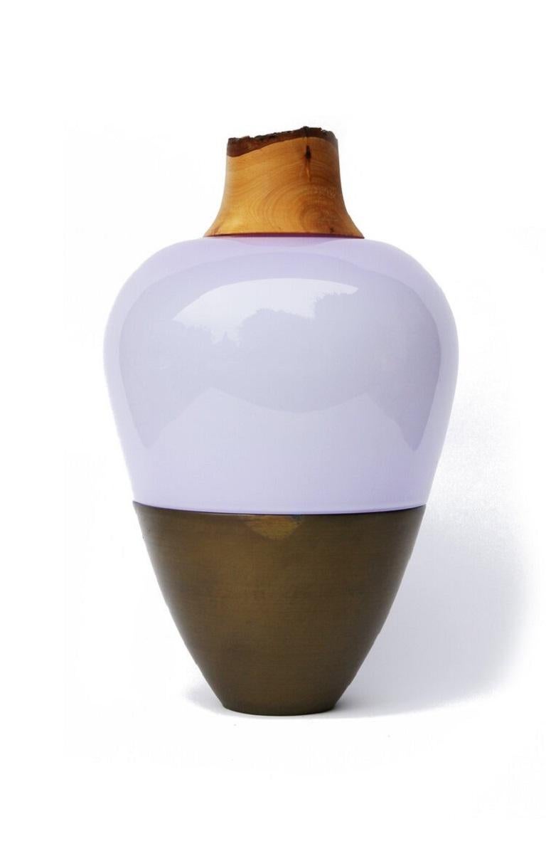 Lavender and brass patina India vessel I, Pia Wüstenberg
Dimensions: D 20 x H 38
Materials: glass, wood, brass
Available in other metal: brass, copper, brass patina, copper patina

Handmade in Europe, by individual craftsmen: handblown glass
