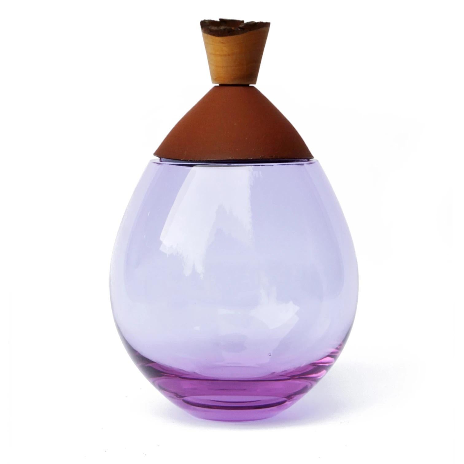 Lavender and terracotta Satu stacking vessel, Pia Wüstenberg
Dimensions: D 19 x H 23
Materials: glass, wood, ceramic
Available in other colors.

Handmade in Europe: handblown glass (Czech Republic), earthenware ceramic (Germany), hand turned