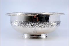 Lavender in silver with floral engravings on the edge and rim on a smooth base