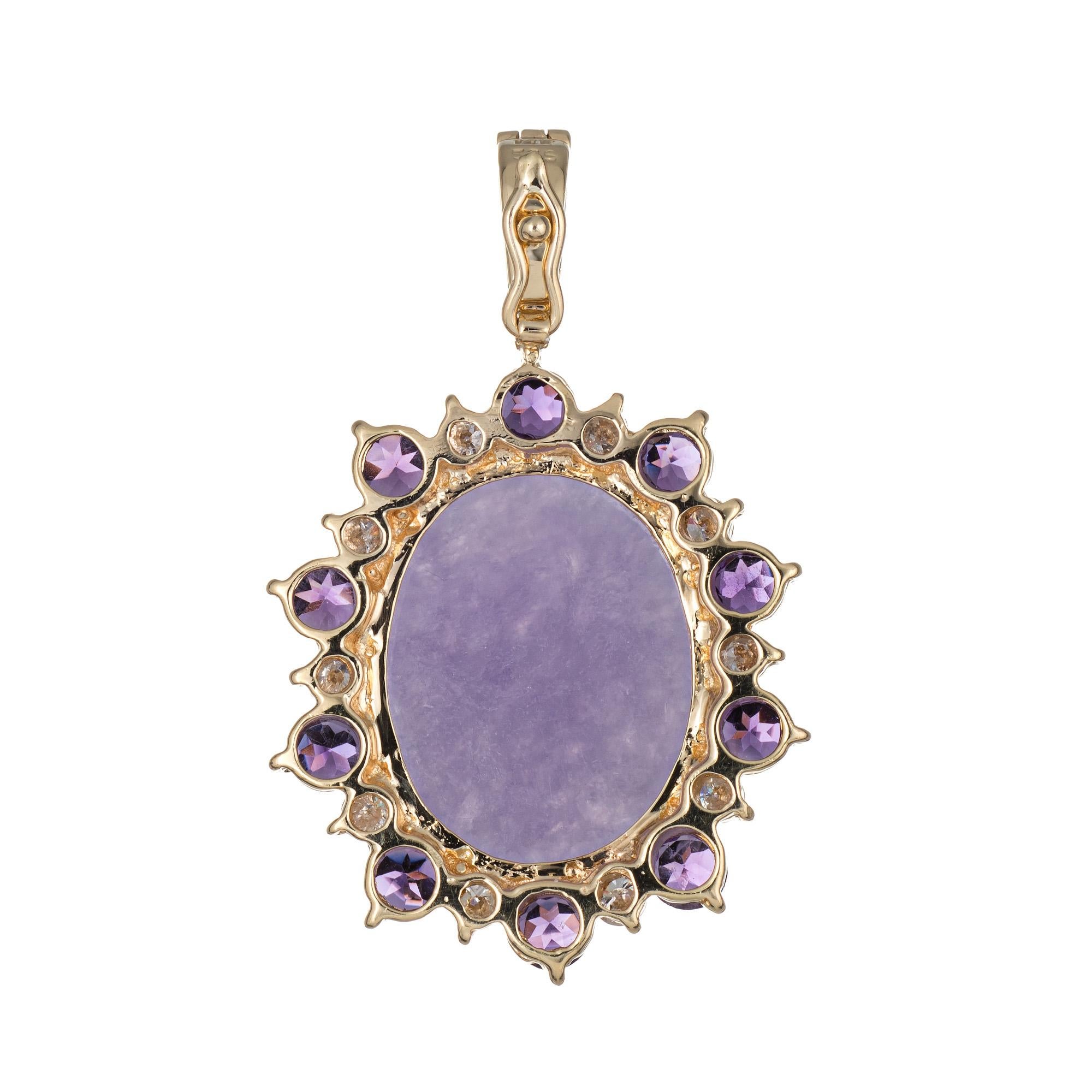 Finely detailed lavender jade, amethyst & diamond pendant crafted in 14 karat yellow gold.  

Cabochon cut lavender jade measures 18mm x 15mm (estimated at 24 carats) is accented with 10 estimated 0.08 carat amethysts (0.80 carats total estimated