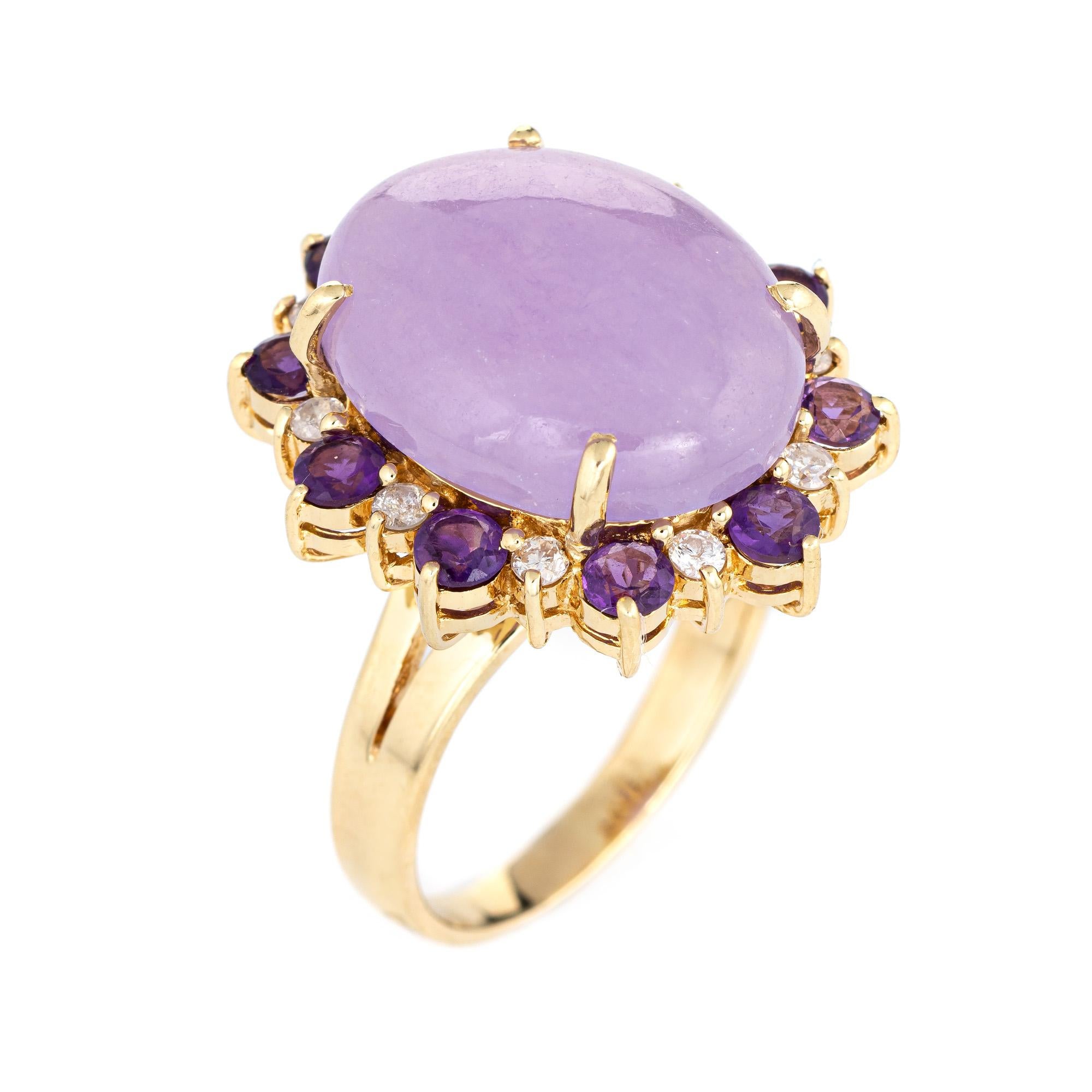 Stylish estate lavender jade, amethyst & diamond cocktail ring crafted in 14 karat yellow gold. 

Cabochon cut lavender jade measures 18mm x 15mm (estimated at 25 carats), accented with an estimated 0.50 carats of amethysts. The diamonds total an