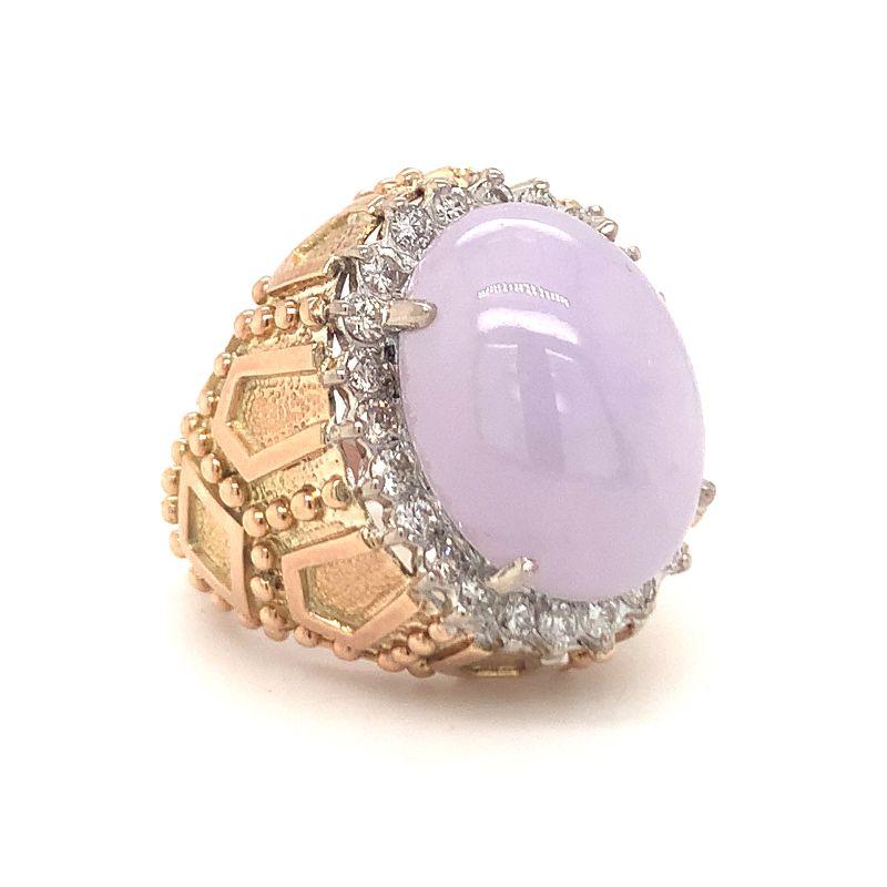One lavender jade and diamond 14K yellow gold ring with ornate designer accents throughout and centering one oval cabochon jade measuring 18.5 x 14 x 8 mm. with GIA Report No. 5212882255 stating Jadeite Jade with no indications of impregnation.