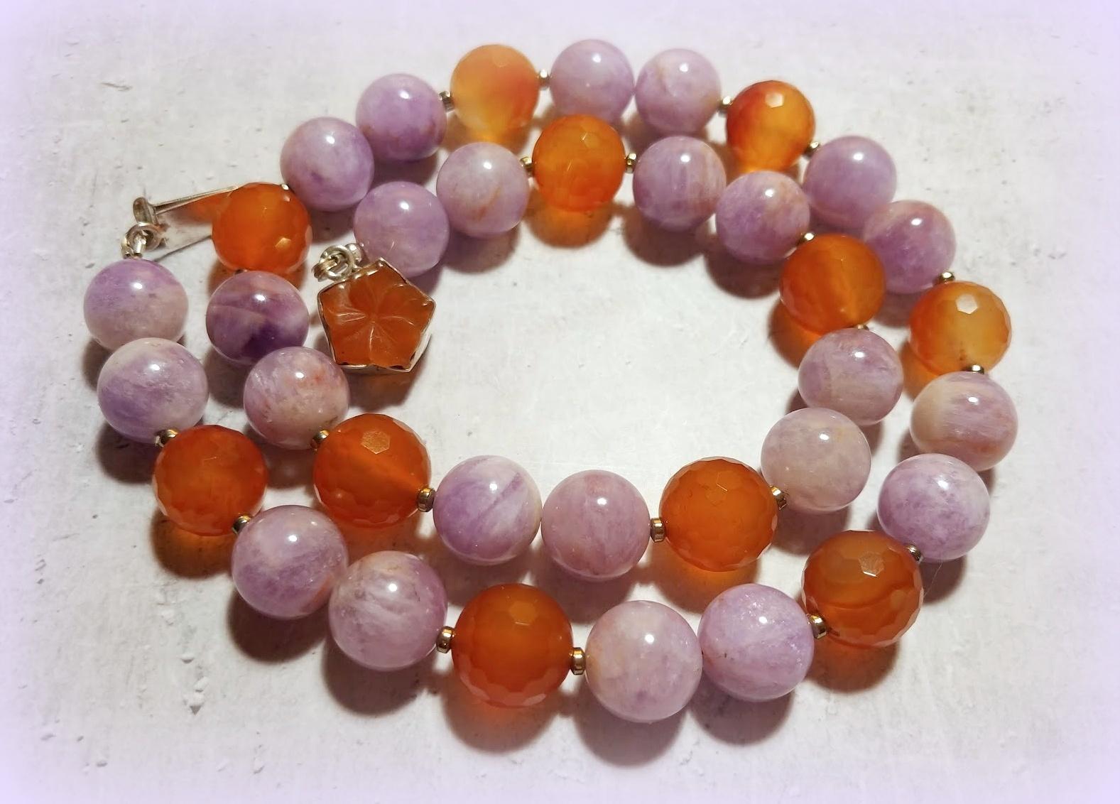 Natural Lavender Jade and Faceted Carnelian Necklace with Lovely Vintage Carnelian Clasp.
Pretty necklace!
The necklace is 22.5 inches (57 cm) long. 
The size of the round lavender jade beads is 14 mm. 
The size of the faceted carnelian beads is