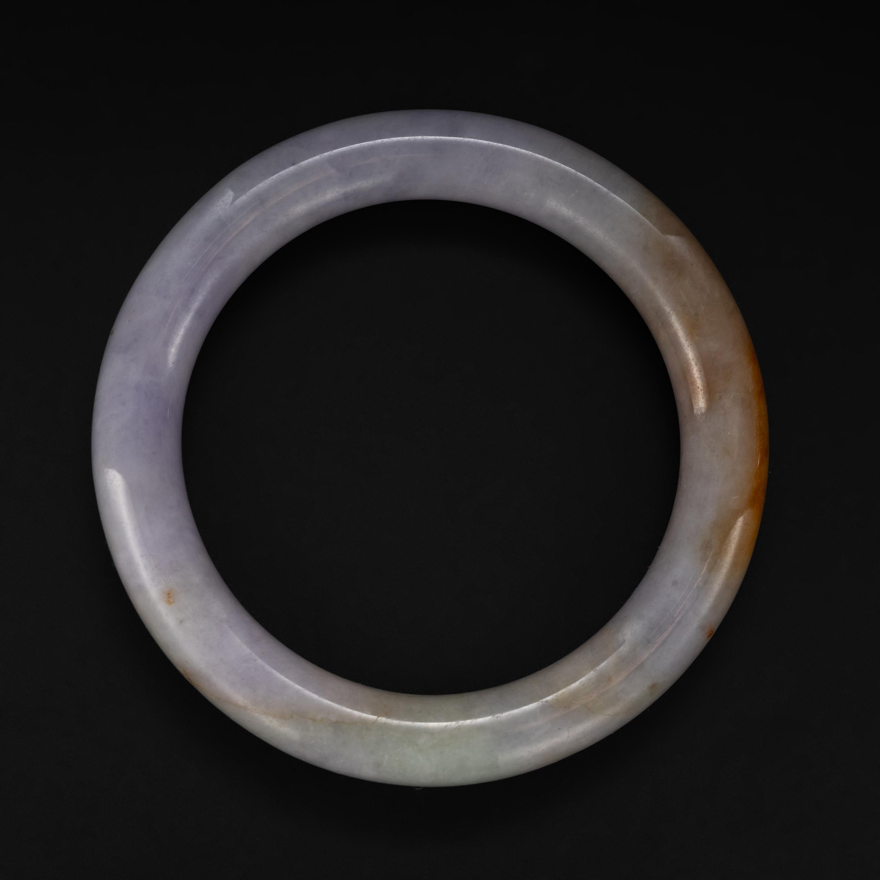Describing the nuance of jade can be rather like trying to define music with words or explain the euphoric aroma of your baby's hair. Words can seem measly. But we have to try.

The color and emotional impact of this fine jade bangle made me think