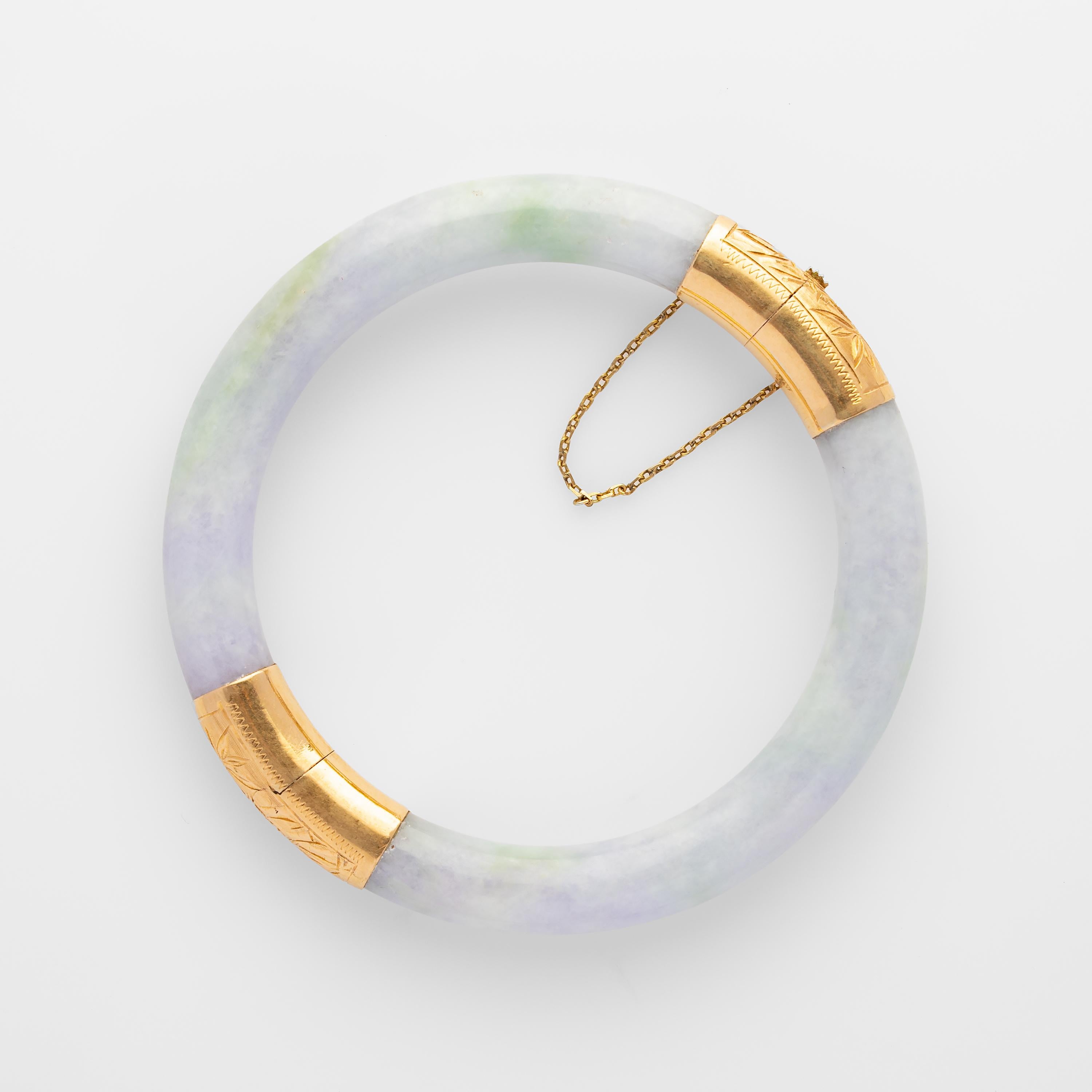 This 1950s-era hand-carved jade bangle is a luminous lavender with just a faint hint of green. The bangle has an inner diameter of 61mm and it opens to 91mm, making this bangle suitable for somebody with larger hands. The exterior dimensions are
