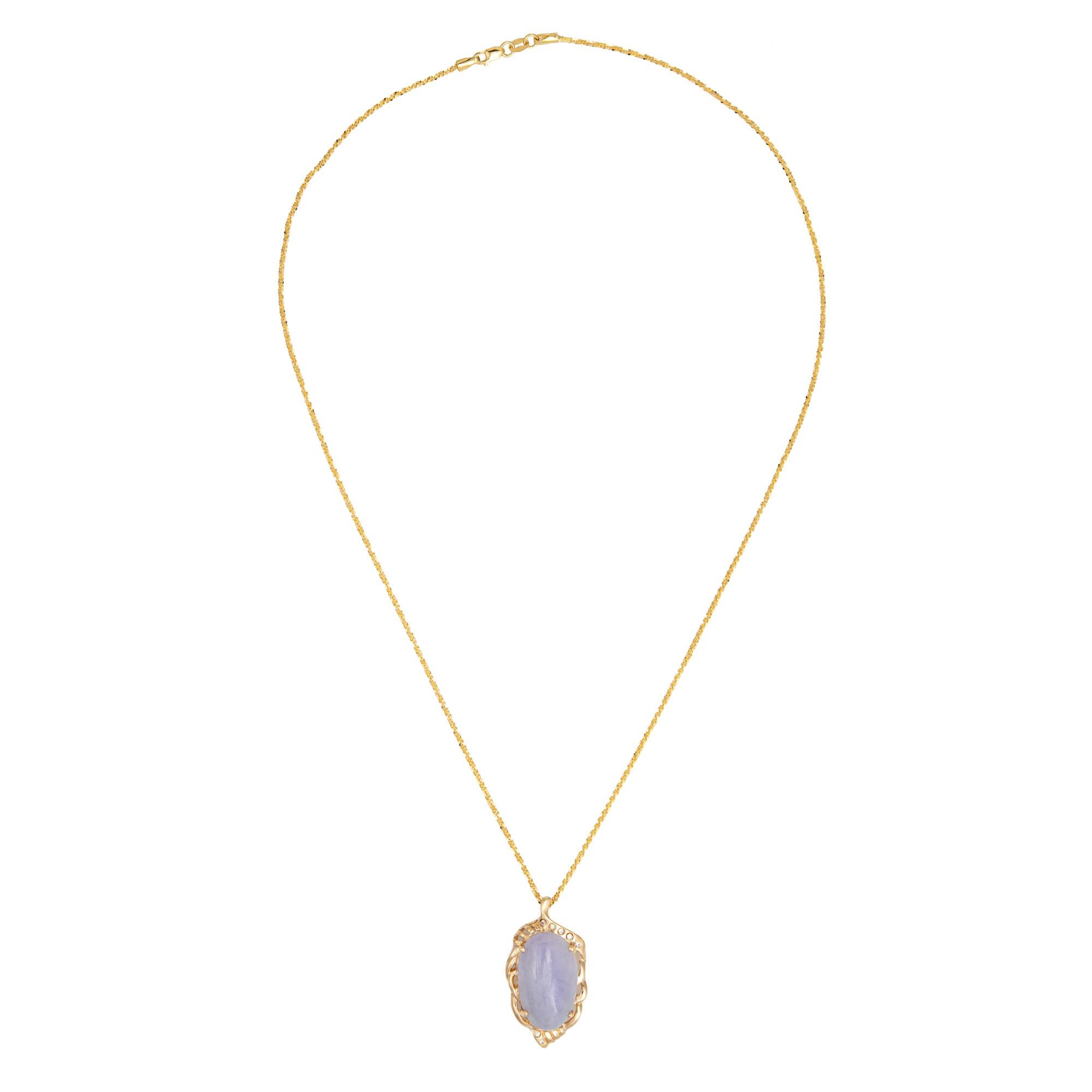Stylish and finely detailed lavender jade & diamond necklace crafted in 14 karat yellow gold (circa 1970s to 1980s).

Cabochon cut lavender jade measures 20mm x 12mm (estimated at 13350 carats), accented with an estimated 0.03 carats of diamonds