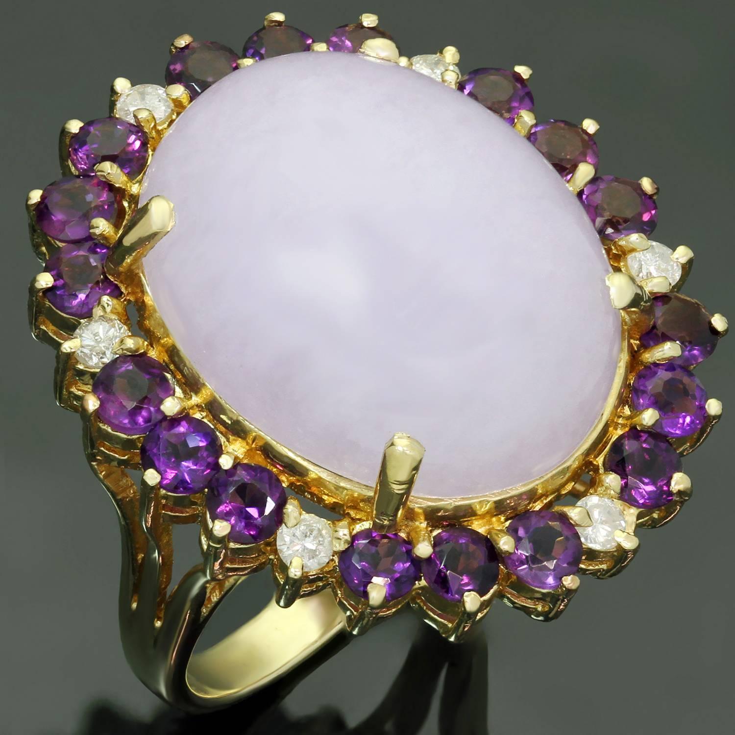 This gorgeous ring is crafted in 14k yellow gold and beautifully set with an oval cabochon lavender jadeite jade measuring 16.5mm x 21.0mm, surrounded with sparkling round amethysts and brilliant-cut round diamonds of an estimated 0.24 carats. Made