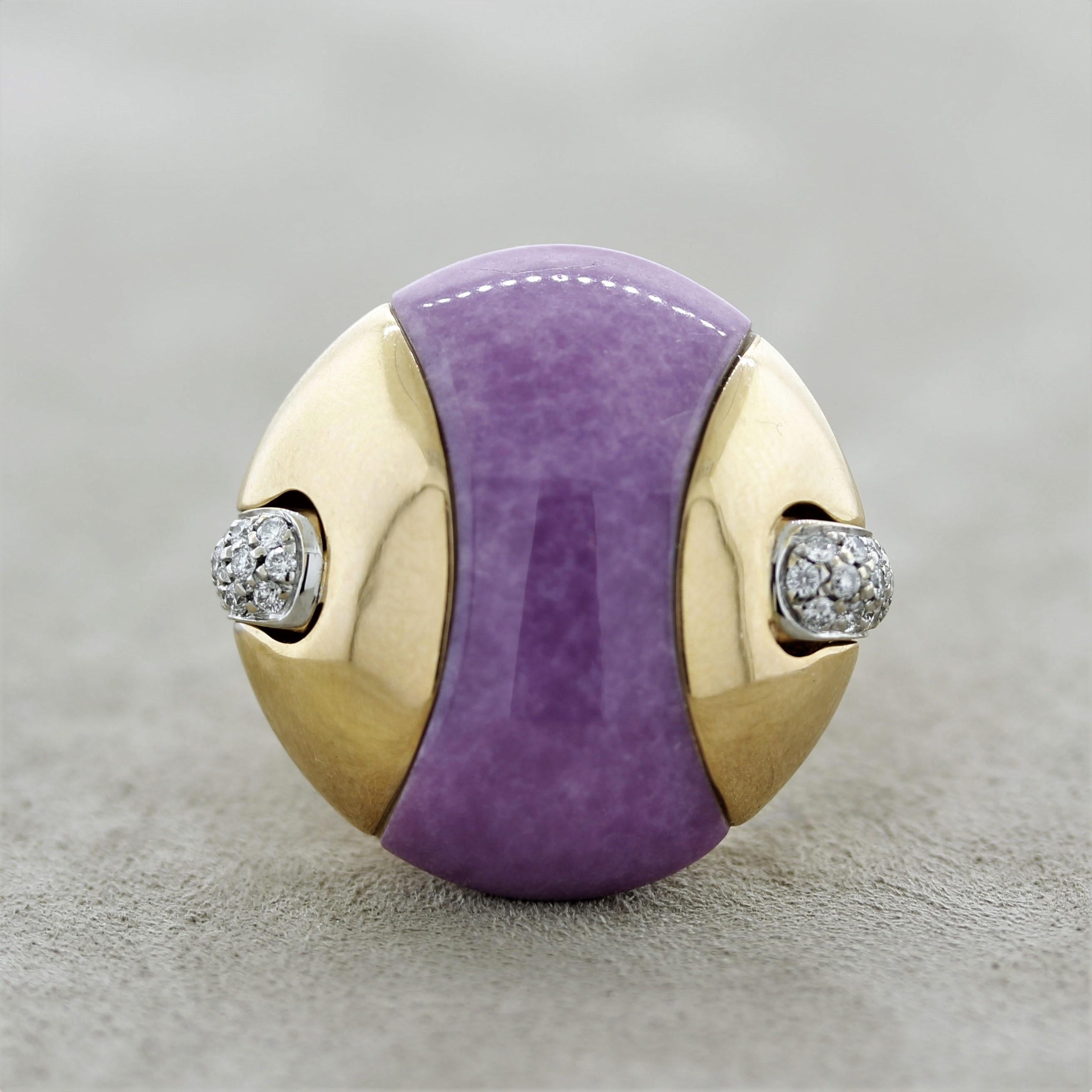 A uniquely designed ring featuring a hand carved and polished lavender jade weighing 24.75 carats. It is carved to fit exactly between the gold sides of the ring creating a seamless finish. It is accented by 0.42 carats of round brilliant-cut