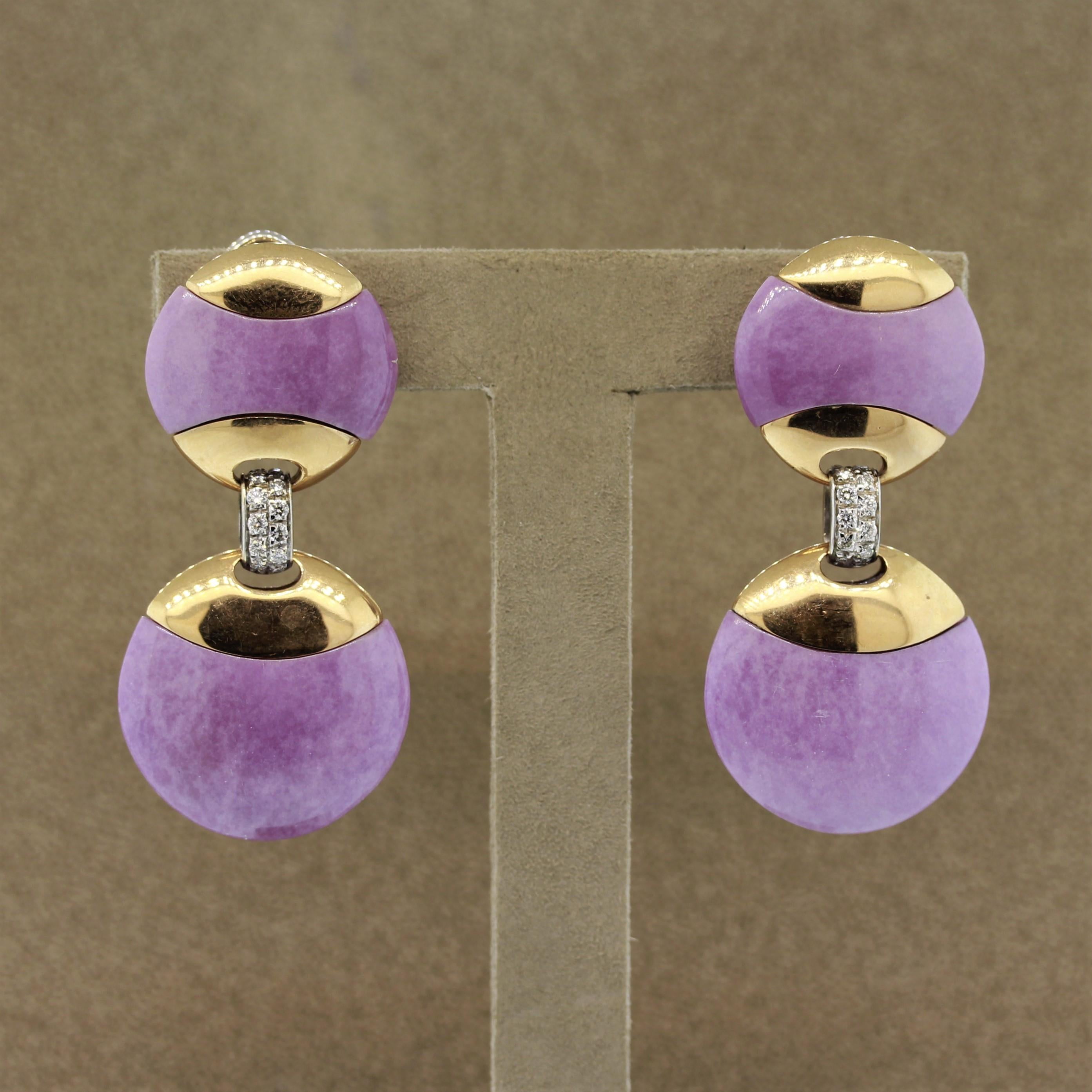 A unique pair of earrings featuring 22.40 carats of lavender jade which has been hand carved and shaped into matching discs. They are set with 18k gold which complete form and are set as a drop from one another. They are accented by 0.42 carats of