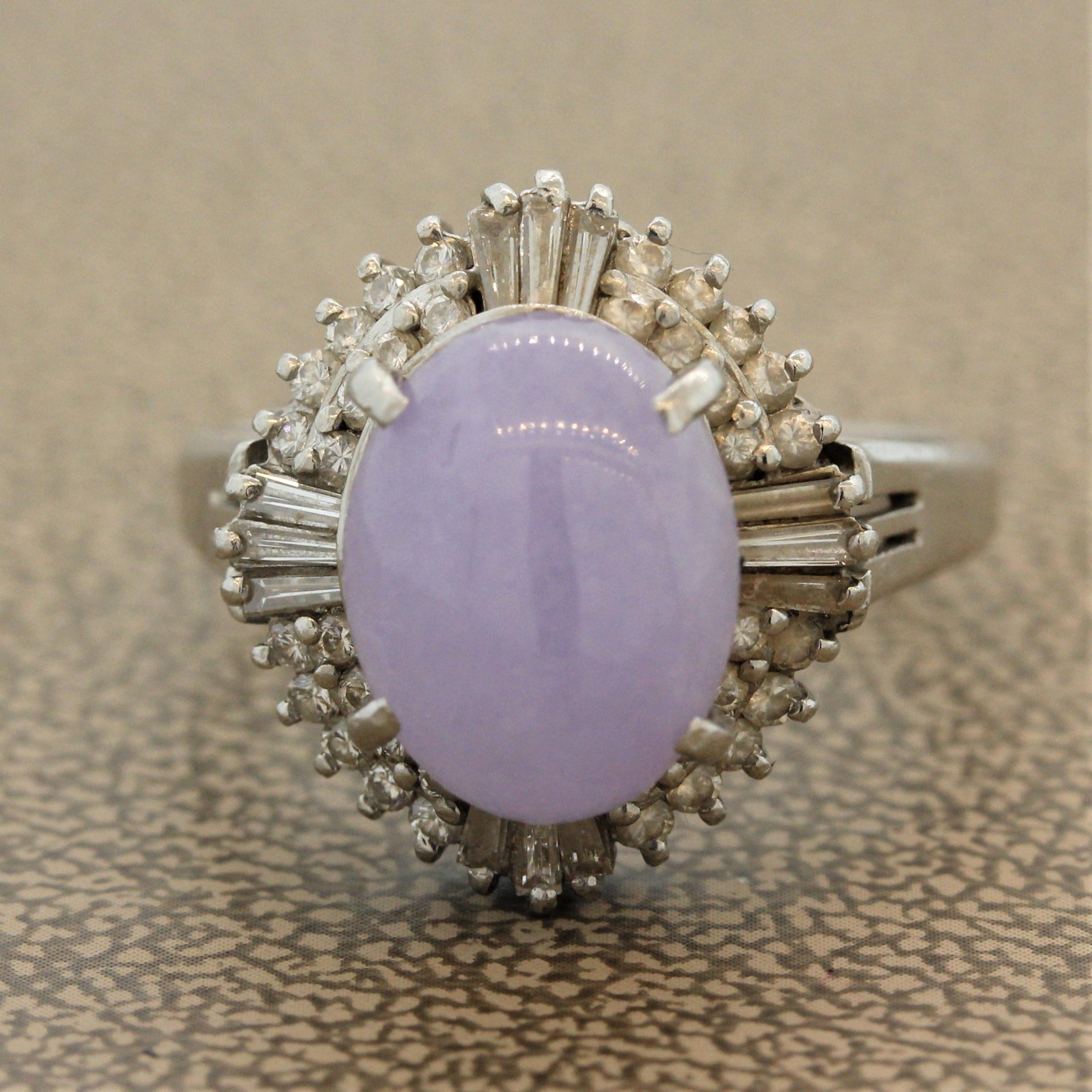 A sweet piece of natural jadeite jade takes center stage. It is a soft and velvety lavender color and weighs approximately 3.50 carats. It is surrounded by baguette and round brilliant cut diamonds weighing a total of 0.57 carats. Hand fabricated in