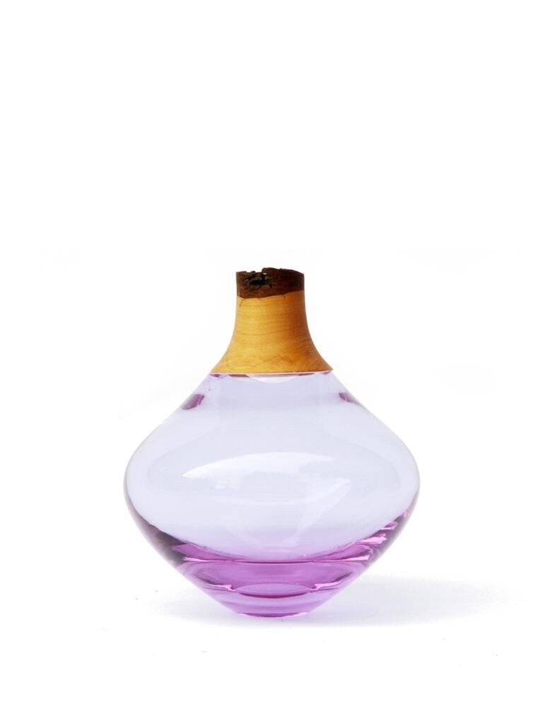 Lavender Matisse stacking. vessel II, Pia Wüstenberg.
Dimensions: D 12 x H 16.
Materials: glass, wood.

The Matisse Stacking Vessels are treasures, small splashes of curvy glass with a wooden crown. The collection was originally designed for the