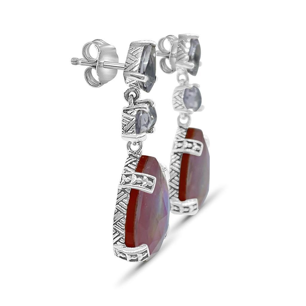 Lavender, Moon Quart, Rock Crystal, Mother of Pearl, and Red Agate with Sterling Silver Accent Drop Earring

Stephen’s heart and passion go into each Dweck design, as the placement of each stone and its connection to nature has meaning. While bold