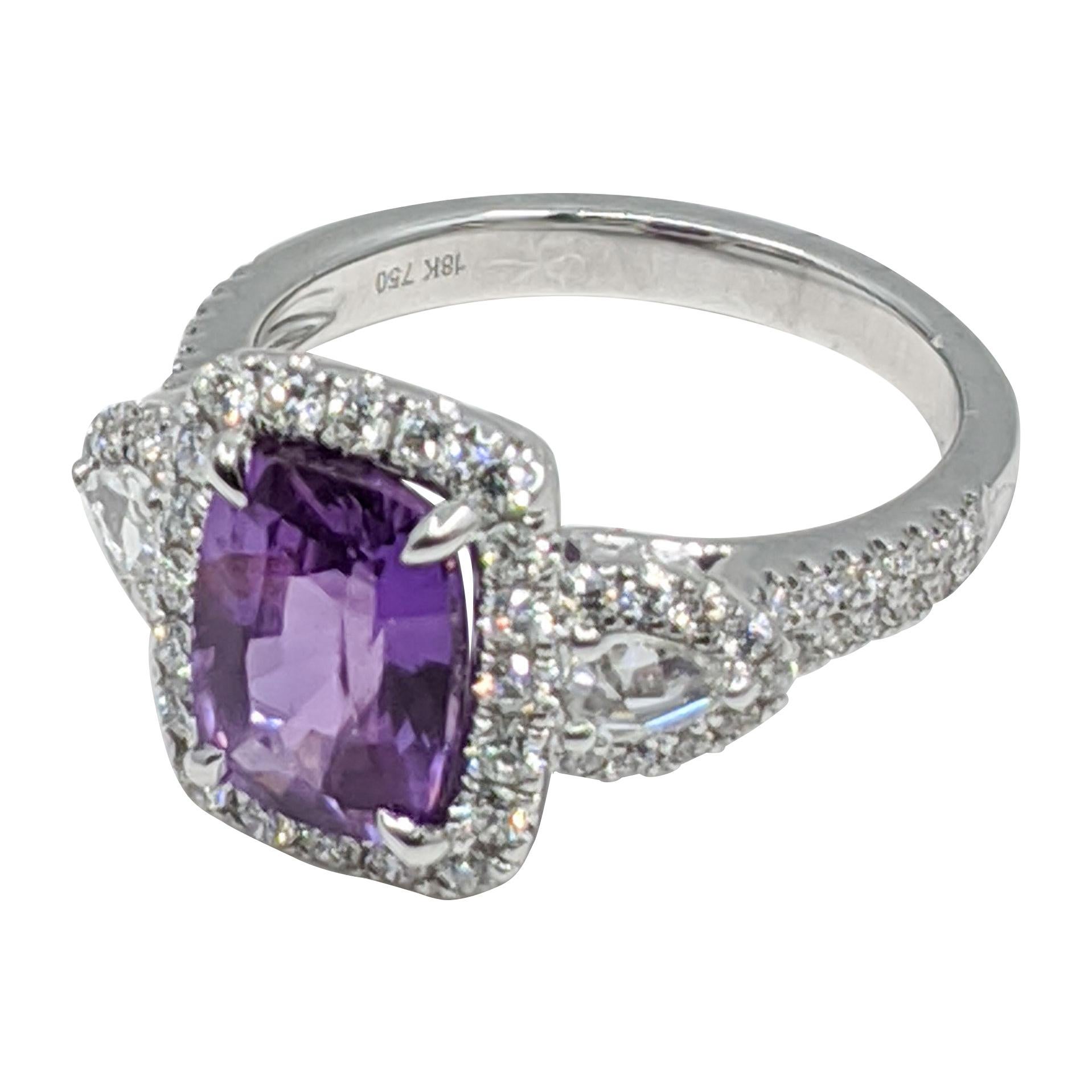 Lavender Sapphire (No heat) ring, with white diamond stones. 18k Gold
CENTER  3.06 CRTS   10X7MM
DIAMONDS  .77 CRTS