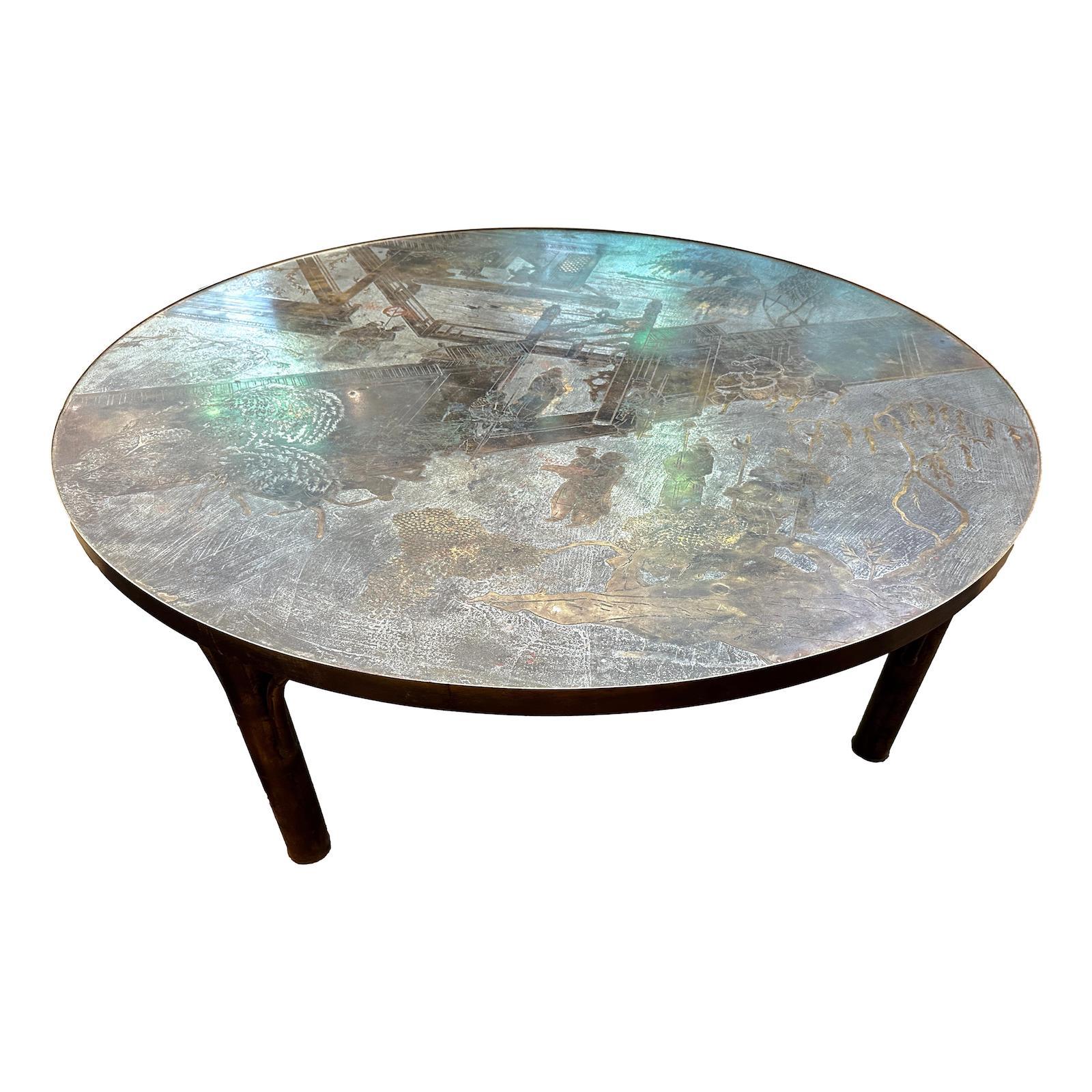 A round circa 1960s LaVerne coffee table with palace scenes in a silver and gilt finish.

Measurements:
Height: 17.25
Diameter: 48.