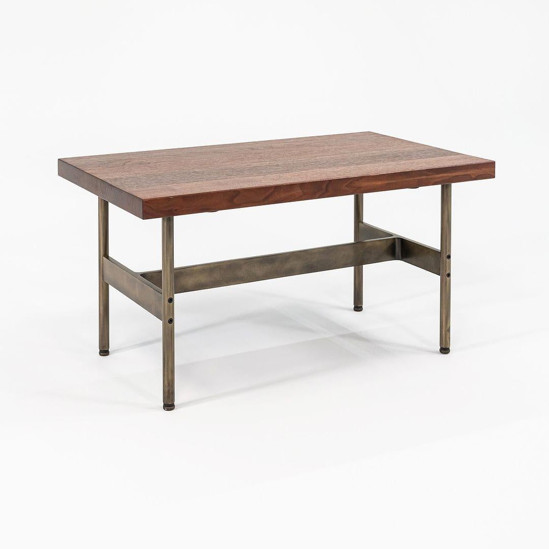 This is a recent production Laverne cocktail table with a solid walnut top and medium antique bronze frame, produced by Gratz Industries. Gratz Industries was one of the original manufacturers of Laverne furniture and continued to work with designer