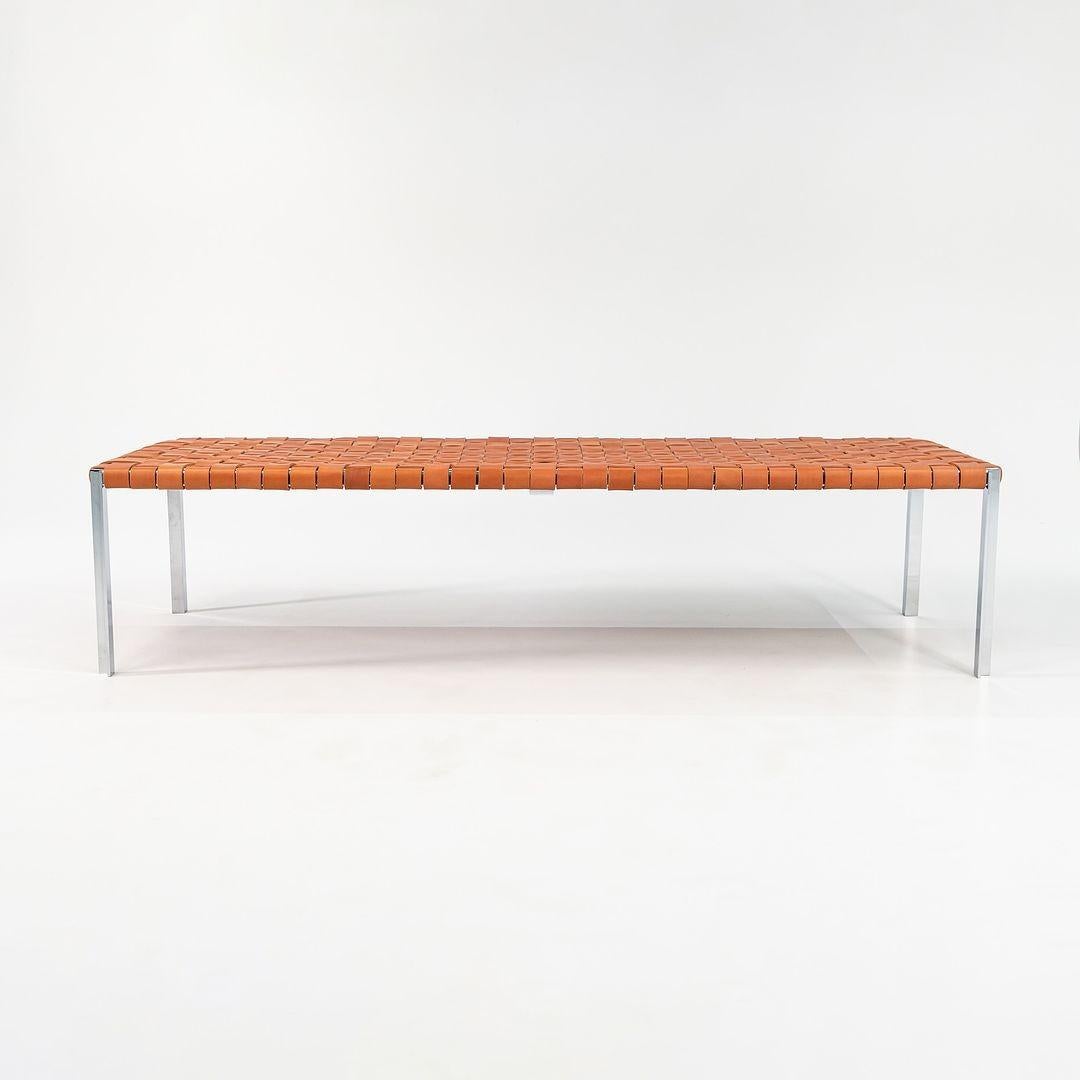 This is a TG-18 Long Woven Leather Bench in tan leather with a polished chrome frame produced by Gratz Industries. The bench was designed was designed by Katavolos, Littell and Kelley in 1952 as part of the original Laverne Collection produced by