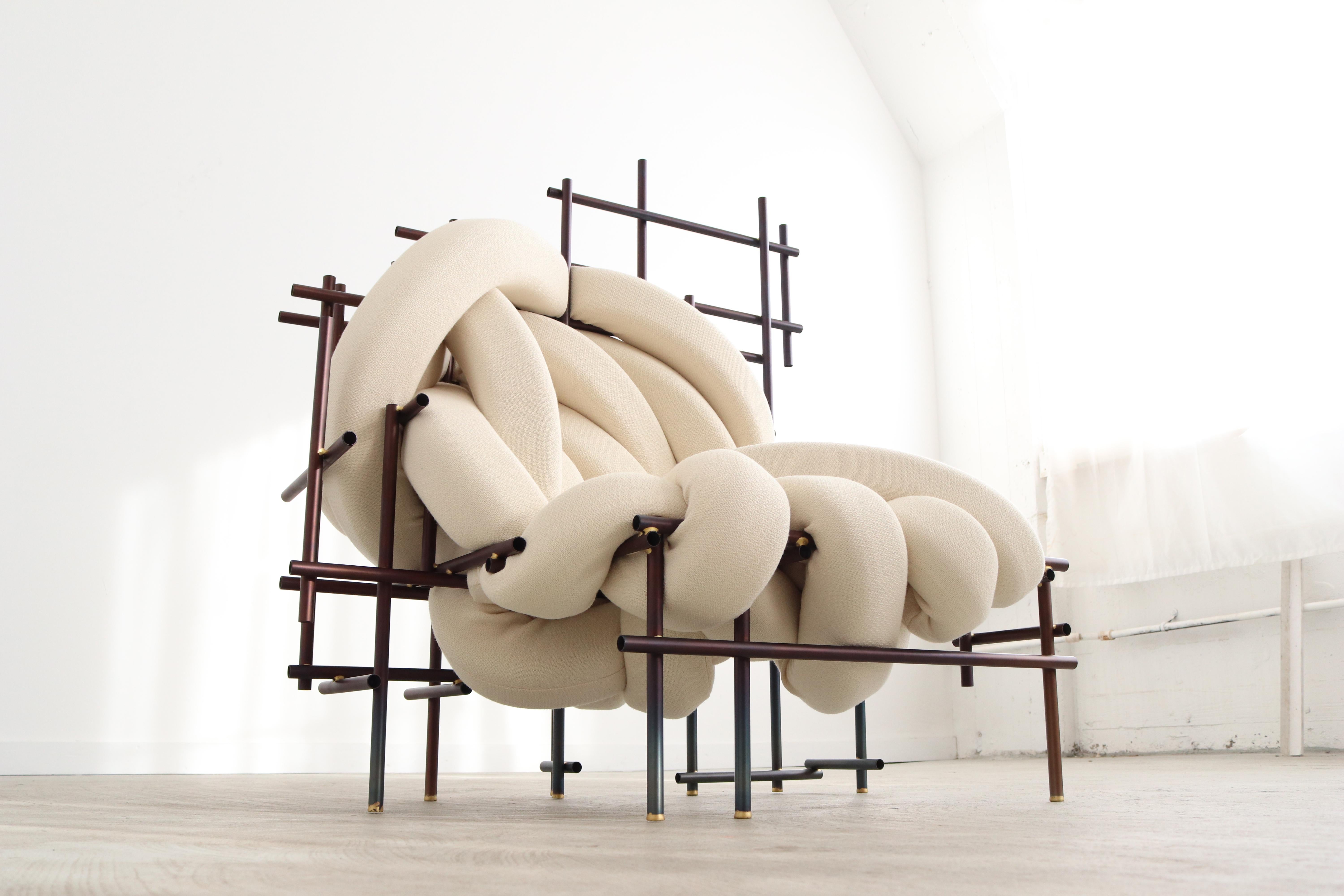 Lawless Fauteuil by Evan Fay
Each is a unique hand-sculpted creation 
Dimensions: 111 x 80 x 120 cm
Materials: Steel pipe, brass connections foam, scuba knit fabric

Lawless chair is a celebration of irregularity within a system, pursuing a
