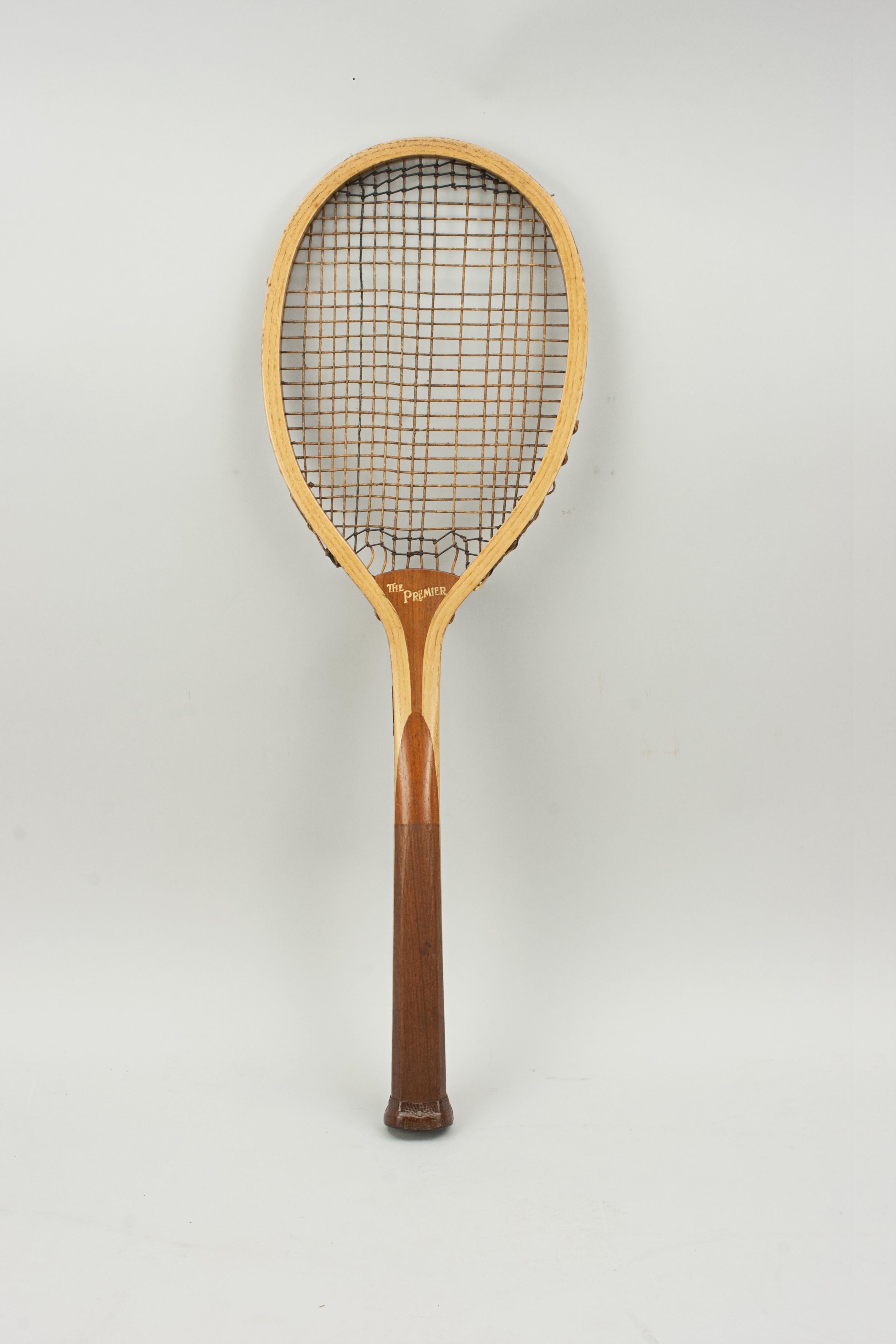 Imported lawn tennis racket, Kertész T?dor, Budapest.
A wooden lawn tennis racket 'The Premier'. A nice ash framed racket with convex wedge. The walnut wedge is embossed 'The Premier' on one side and 'Imported by Kertész T?dor, Budapest' on the