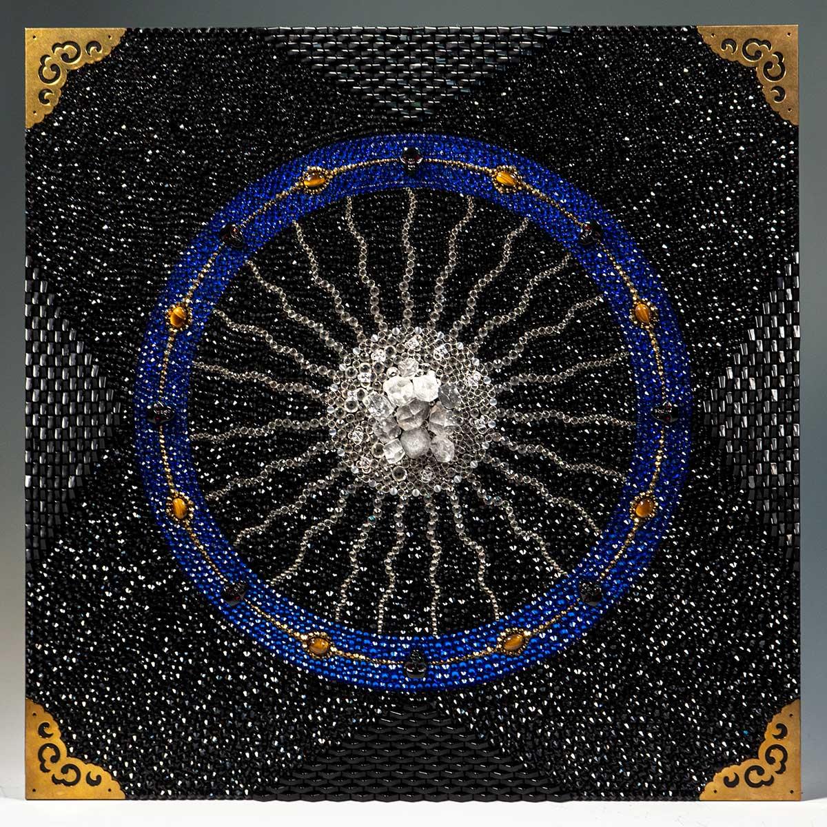 Lawrence Naff's 'Invocation', from 2022, is a Mixed Media work on wood panel measuring 20 x 20 x 1.5 inches. This piece includes Rhinestones, Apophylite, Tiger's Eye, and Cubic Zirconia. Naff's dazzling work includes elements, both natural and