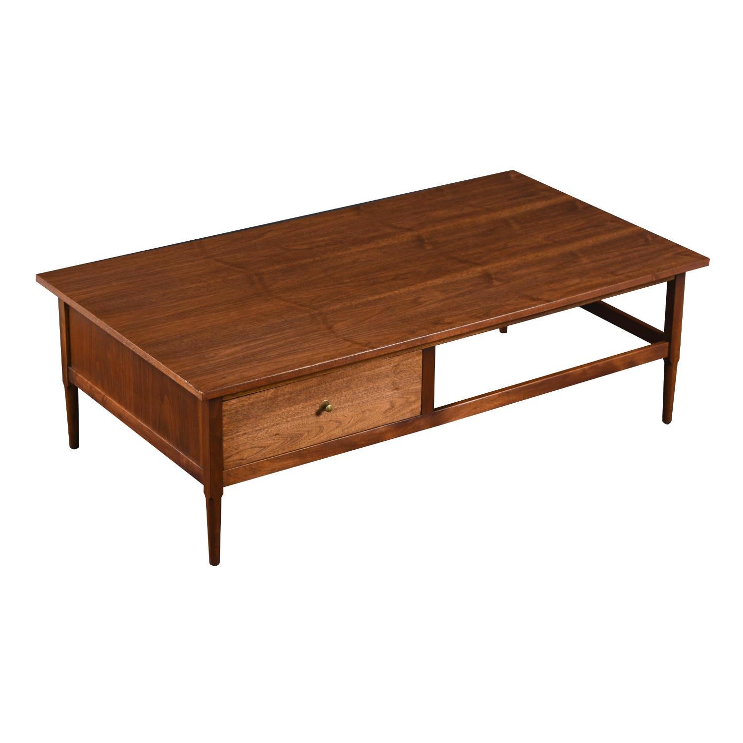 Exquisite craftsmanship abounds on this large rectangular mid-century modern coffee table. The walnut coffee table was designed by Lawrence Peabody for Richardson Nemschoff and, fortunately, still has the label. Mid-Century Modern meets traditional